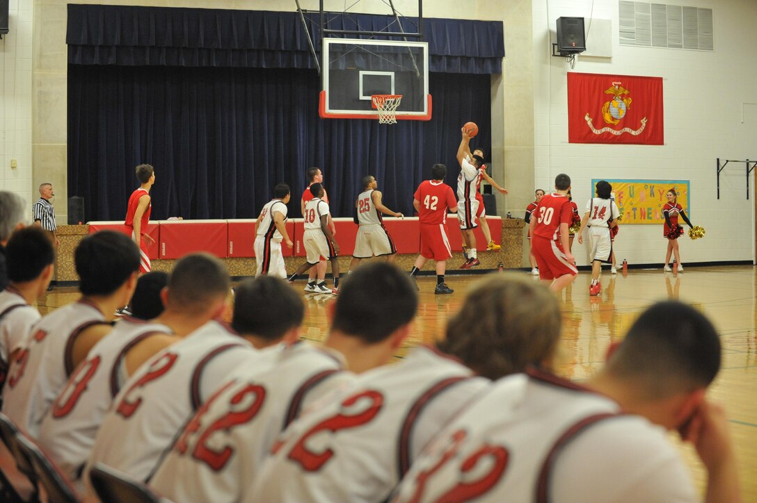 The Quantico Middle/High School Warriors players look on as their team attempts to add more points to the board during a home game against the Wakefield Country Day School Owls Feb. 7. At the end of the game, the Warriors were able to squeeze out a win, 41-40. 