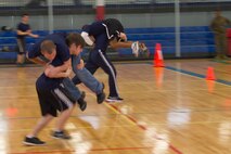 Poolees from Recruiting Substations North Milwaukee, Racine, South Milwaukee and Waukesha competed against each other during their annual Butt Kicking Field Meet Feb. 8.  Events included a pull-up challenge, shuttle run and the culminating tug of war tournament.