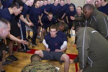 Poolees from Recruiting Substations North Milwaukee, Racine, South Milwaukee and Waukesha competed against each other during their annual Butt Kicking Field Meet Feb. 8.  Events included a pull-up challenge, shuttle run and the culminating tug of war tournament.