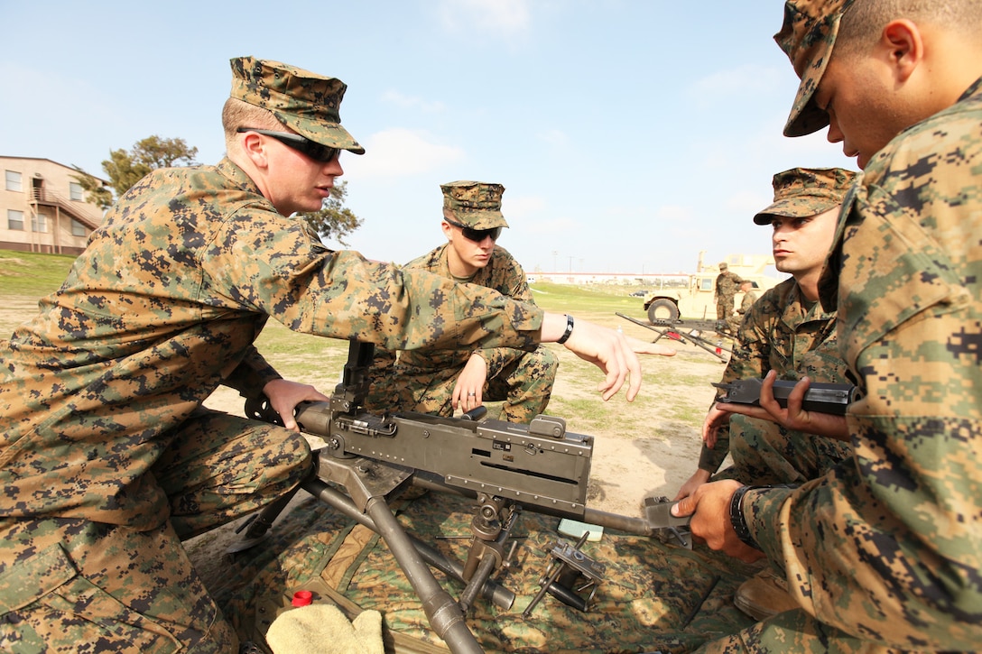 Sgt. Jason Hillman, a military policeman with Bravo Company, 1st Law Enforcement Battalion, I Marine Expeditionary Force, instructs Marines on the proper assembly of a .50-caliber machine gun during a weapons training course at Camp Pendleton, Calif., Feb. 7. One of the responsibilities of 1st LE Bn., while deployed is to teach foreign nationals to properly clean and operate various weapons used for law enforcement and military operations. Hillman, 25, is from Portalnd, Ore.


