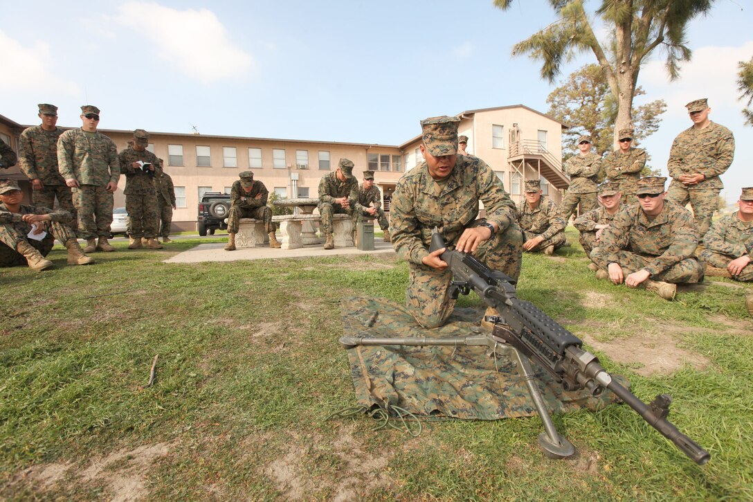 Lance Cpl. Leo Chicas, a military policeman with Bravo Company, 1st Law Enforcement Battalion, I Marine Expeditionary Force, instructs his peers on the proper operating procedures of an M240B machine gun during a weapons training course at Camp Pendleton, Calif., Feb. 7. One of the responsibilities of 1st LE Bn., while deployed is to teach foreign nationals to properly clean and operate various weapons used for law enforcement and military operations. Chicas, 25, is from Queens, N.Y.


