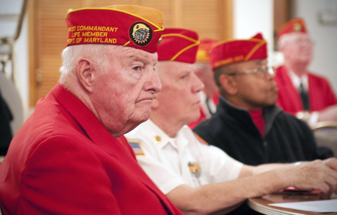 Jack Colleran, the chief-of-staff for Marine Corps League Detachment 565, Baltimore, observes the crowd during the monthly meeting, Nov. 16, 2012. Colleran, who spent 32 years in the Marine Corps Reserve and retired as a sergeant major, has been with the detachment since they purchased the Marine Corps League building more than 20 years ago. From this facility, the members of the detachment help out their fellow Marines, children, needy and their community.  (U.S. Marine Corps photo by Cpl. Marcin Platek/Released) 
