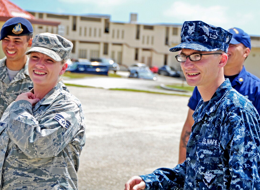 Students from the Airman Leadership School have laughs and take a breather after finishing their control evaluation at Andersen Air Force Base, Guam, Feb. 8, 2013. This is the first class in Andersen ALS history with a Coast Guard student, and the second class with Navy participation. (U.S. Air Force photo by Airman 1st Class Marianique Santos/Released) (U.S. Air Force photo by Airman 1st Class Marianique Santos/Released)