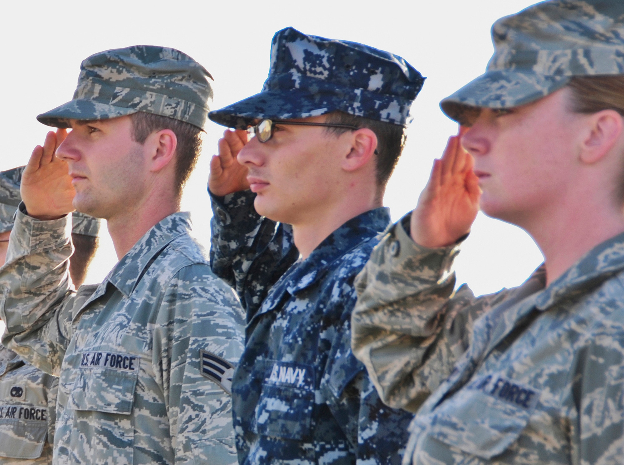 Students from the Airman Leadership School salute during a flag-raising ceremony on Andersen Air Force Base, Guam, Feb. 7, 2013. ALS prepares and trains future NCOs for increased responsibilities and is one of many professional military education courses in the Air Force. (U.S. Air Force photo by Airman 1st Class Marianique Santos/Released)