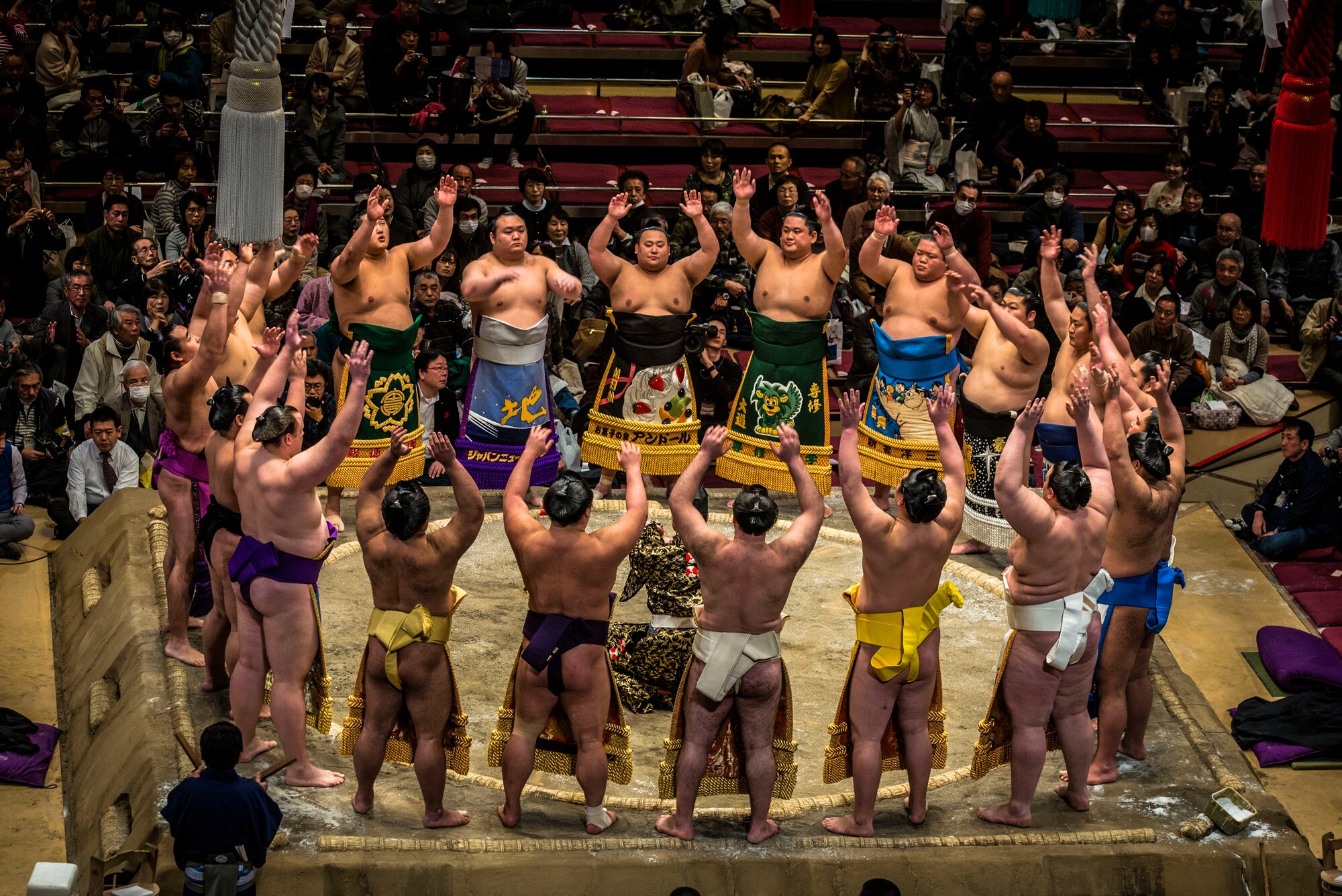 YOKOTA AIR BASE,Japan--Top division Sumo wrestlers form a circle at the opening ceremony of the Grand Sumo Tournament at the Ryogoku Kokugikan Sumo Hall in Tokyo, Feb. 10, 2013. Sumo involves several ritual elements developed over a history of centuries. (U.S. Air Force photo by Capt. Raymond Geoffroy)