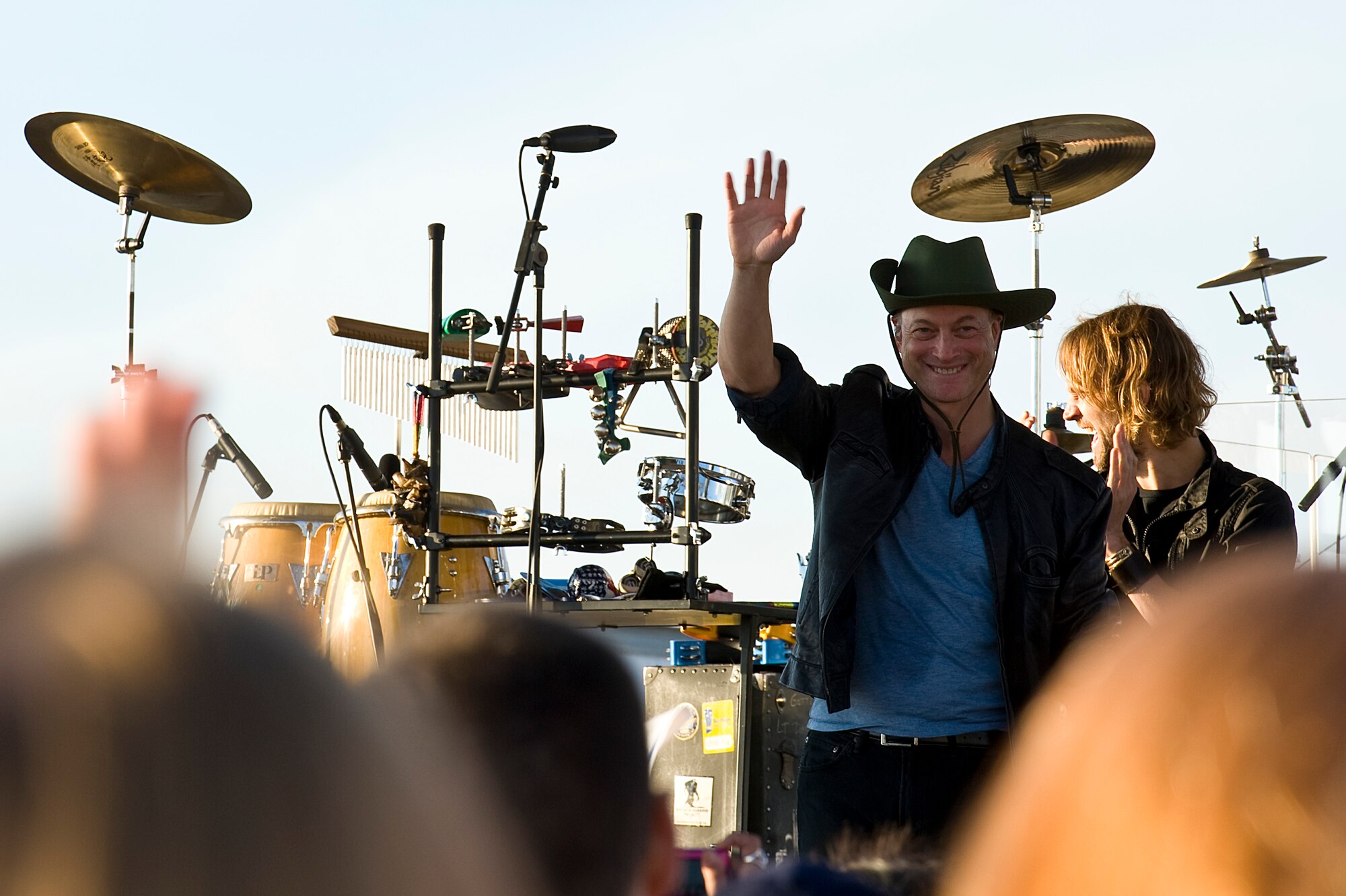 Gary Sinise and the Lt. Dan Band perform a concert for Hurlburt airmen,family and guests on the flight line on Hurlburt Field, Fla., Feb. 9, 2013.Over 3,000 people attended the free event which was sponsored by HurlburtField Force Support Squadron and the Gary Sinise Foundation.  (U.S. Air Force Photo/ Airman First Class Michelle Vickers)