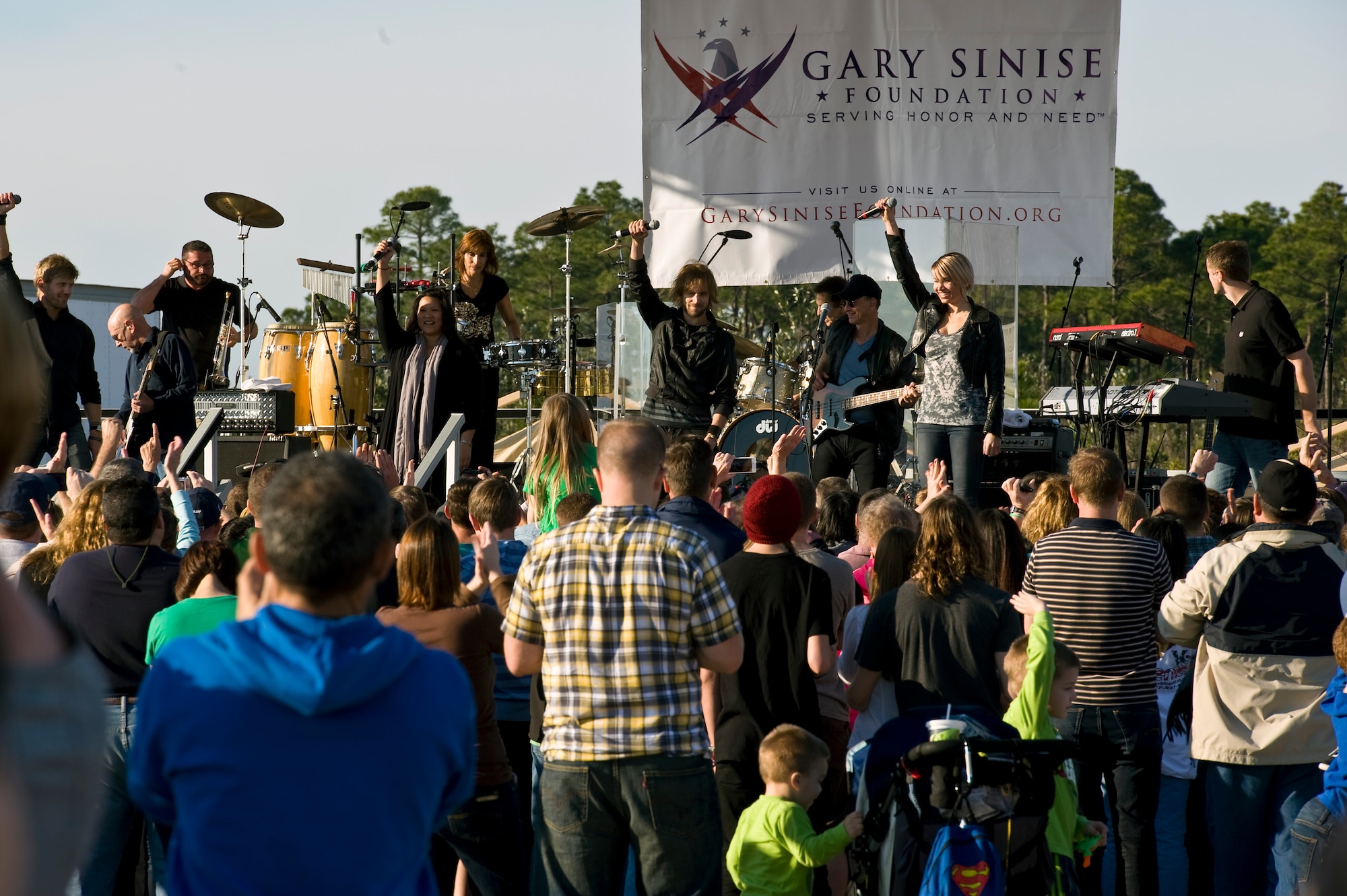 Gary Sinise and the Lt. Dan Band perform a concert for Hurlburt airmen,family and guests on the flight line on Hurlburt Field, Fla., Feb. 9, 2013.Over 3,000 people attended the free event which was sponsored by HurlburtField Force Support Squadron and the Gary Sinise Foundation.  (U.S. Air Force Photo/ Airman First Class Michelle Vickers)