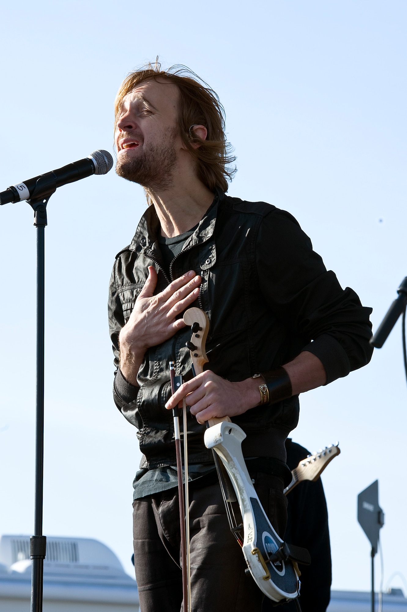 Gary Sinise and the Lt. Dan Band perform a concert for Hurlburt airmen,family and guests on the flight line on Hurlburt Field, Fla., Feb. 9, 2013.Over 3,000 people attended the free event which was sponsored by HurlburtField Force Support Squadron and the Gary Sinise Foundation.  (U.S. Air Force Photo/ Airman First Class Michelle Vickers)