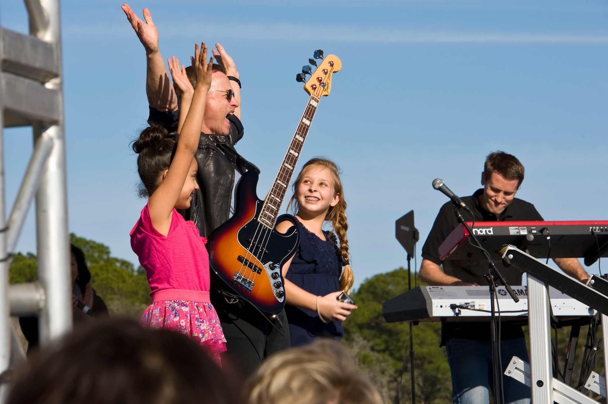 Gary Sinise and the Lt. Dan Band perform a concert for Hurlburt airmen,family and guests on the flight line on Hurlburt Field, Fla., Feb. 9, 2013.Over 3,000 people attended the free event which was sponsored by HurlburtField Force Support Squadron and the Gary Sinise Foundation.  (U.S. Air Force Photo/ Airman First Class Michelle Vickers)
