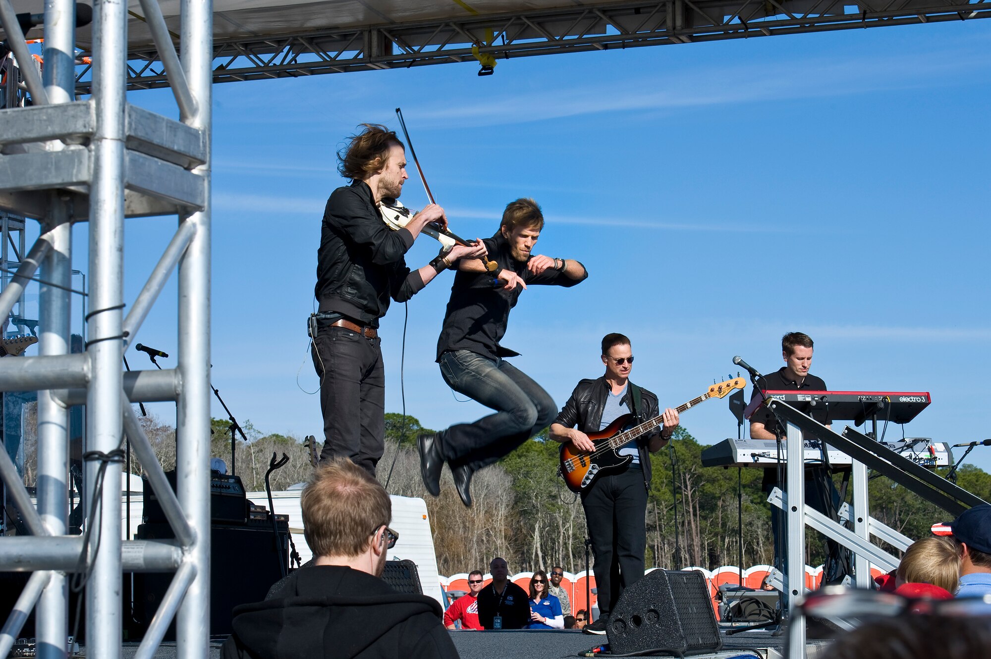 Gary Sinise and the Lt. Dan Band perform a concert for Hurlburt airmen,family and guests on the flight line on Hurlburt Field, Fla., Feb. 9, 2013.Over 3,000 people attended the free event which was sponsored by HurlburtField Force Support Squadron and the Gary Sinise Foundation.  (U.S. Air Force Photo/ Airman First Class Michelle Vickers)