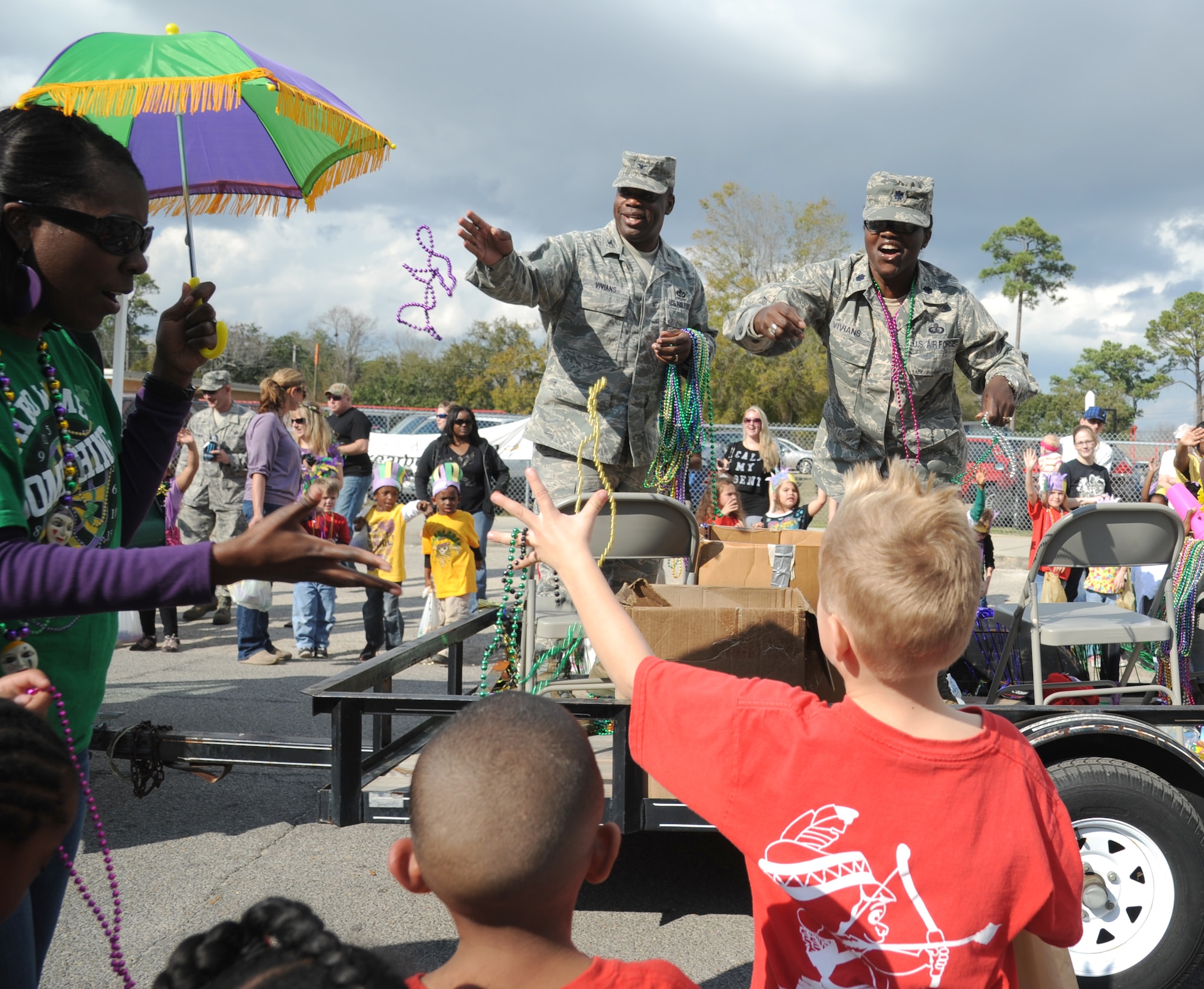 Col. Mark Vivians, 81st Mission Support Group commander, and his wife, Lt. Col. Jileene Vivians, 2nd Air Force director of staff, serve as grand marshals during the Jeff Davis Elementary School Mardi Gras Parade in Biloxi, Miss., Feb. 8, 2013.  The Keesler Honor Guard and other base personnel also participated in the festivities.  (U.S. Air Force photo by Kemberly Groue)