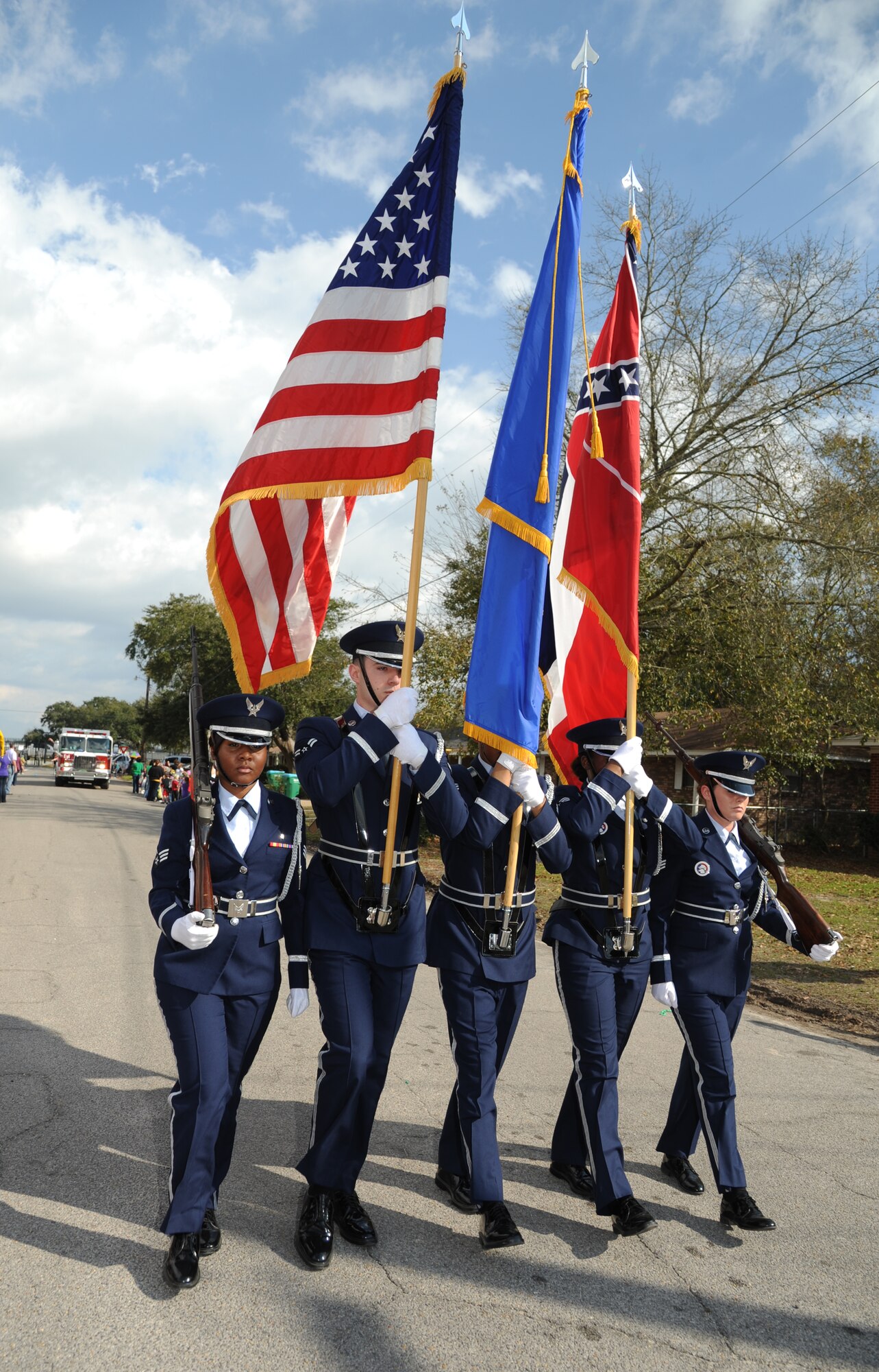 The Keesler Honor Guard leads the Jeff Davis Elementary School Mardi Gras Parade in Biloxi, Miss., Feb. 8, 2013. Col. Mark Vivians, 81st Mission Support Group commander, and his wife, Lt. Col. Jileene Vivians, 2nd Air Force director of staff, served as grand marshals for the event.  (U.S. Air Force photo by Kemberly Groue)