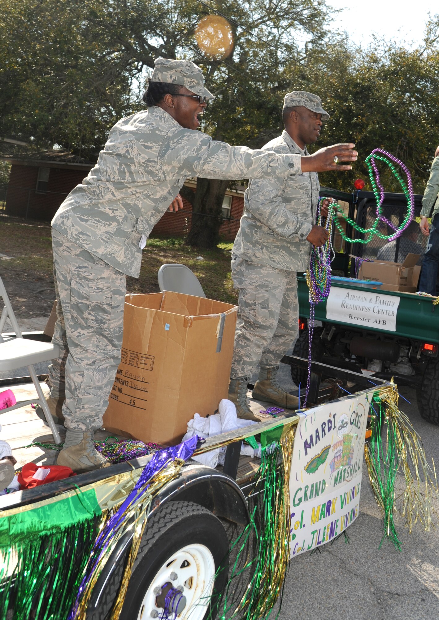 Lt. Col. Jileene Vivians, 2nd Air Force director of staff, and her husband, Col. Mark Vivians, 81st Mission Support Group commander, serve as grand marshals during the Jeff Davis Elementary School Mardi Gras Parade in Biloxi, Miss., Feb. 8, 2013.  The Keesler Honor Guard and other base personnel also participated in the festivities.  (U.S. Air Force photo by Kemberly Groue)