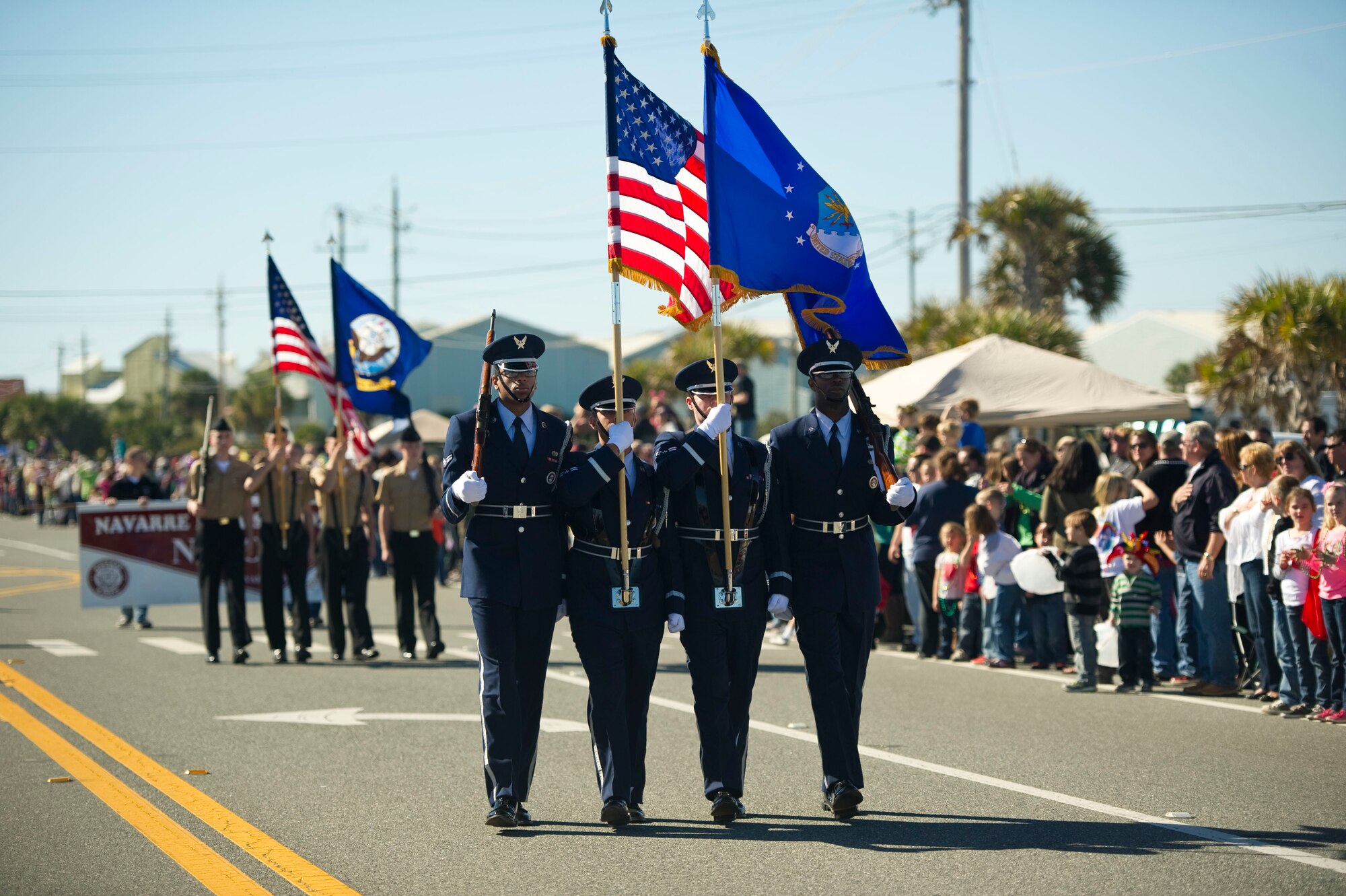 Honor Guardsmen from the 1st Special Operations Wing carry the colors during a mardi gras parade at Navarre Beach, Fla., Feb. 2, 2013. The 1st SOW also participated in the parade with a High Mobility Multipurpose Wheeled Vehicle. (U.S. Air Force photo / Tech. Sgt. Vanessa Valentine)