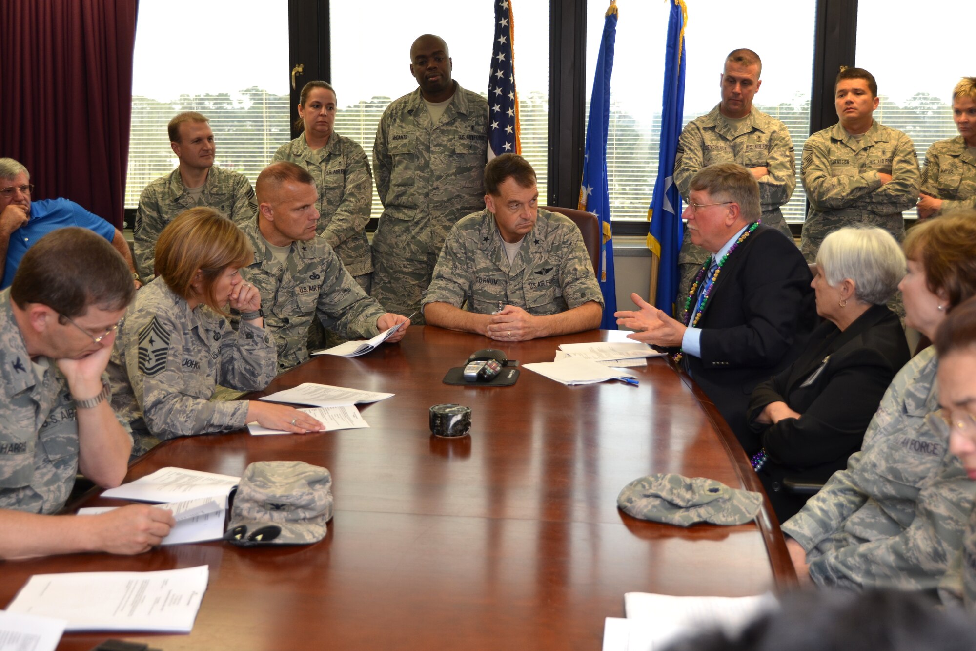 Joint Commission team leader Dr. Larry Kachik, second from right, reviews the team’s report during their Feb. 8, 2013, briefing to the 81st Training Wing commander and command chief and 81st Medical Group senior leadership. The team visited the 81st Medical Group and inspected every facet of its medical care to determine accreditation.  (U.S. Air Force photo by Steve Pivnick)