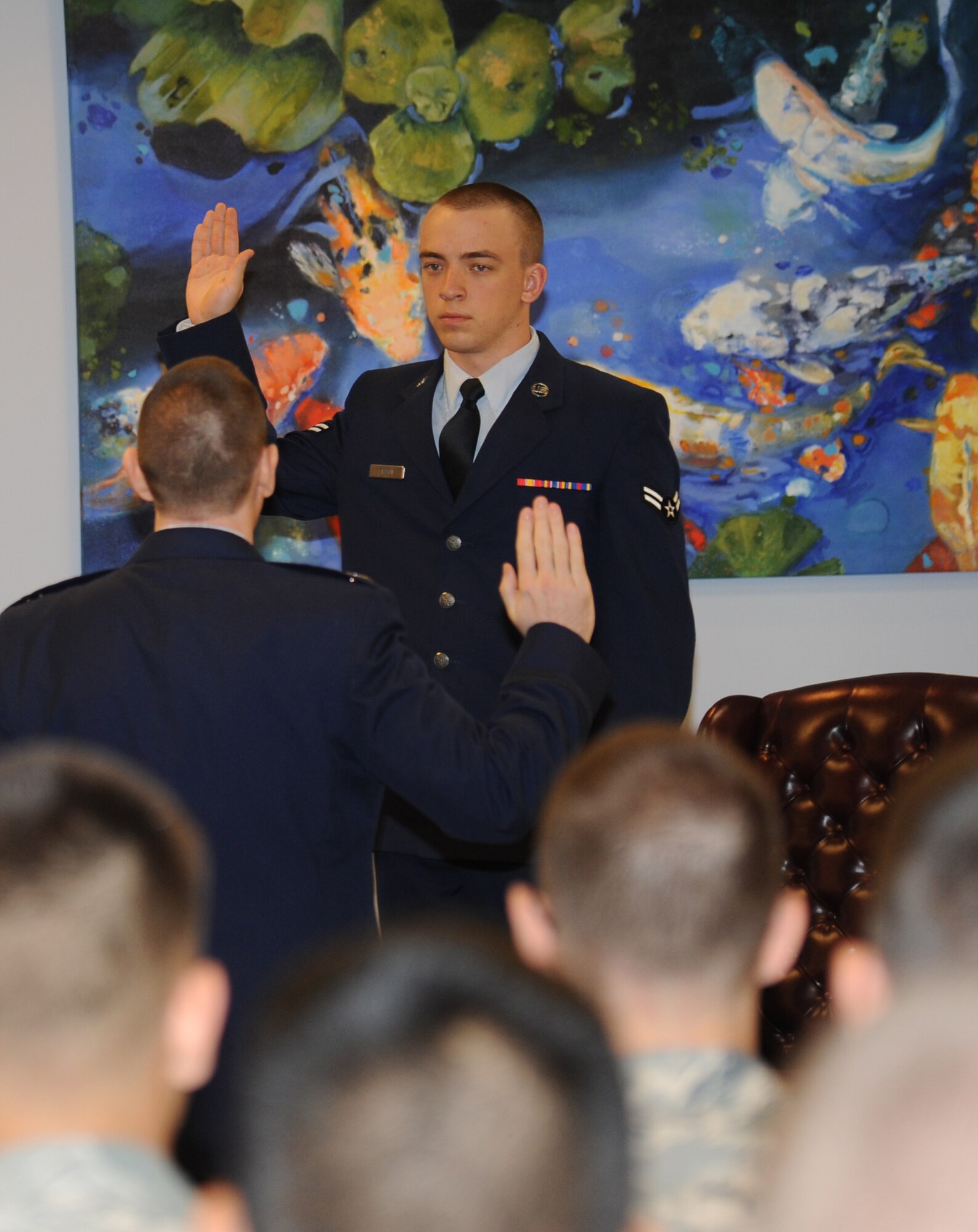Capt. Craig Dunham, 81st Training Wing assistant staff judge advocate, swears in Airman 1st Class Zachary Tagai, 334th Training Squadron, during a summary court martial Feb. 8, 2013, at the Levitow Training Support Facility, Keesler Air Force Base, Miss.  Dunham was the prosecutor and Tagai was a witness in the trial. Mobile summary courts martial set an example for new Airmen about consequences of their actions by quickly imposing good order and discipline.  (U.S. Air Force photo by Kemberly Groue)