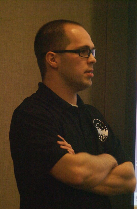 Rob Merrill, a junior Air Force project manager with AEDC’s Propulsion Wind Tunnel Complex, listens as an AEDC employee attending Merrill’s recent technical seminar presentation of a 6-month long Commander’s Challenge 2012 project, asks a question. (Photo by Philip Lorenz III)