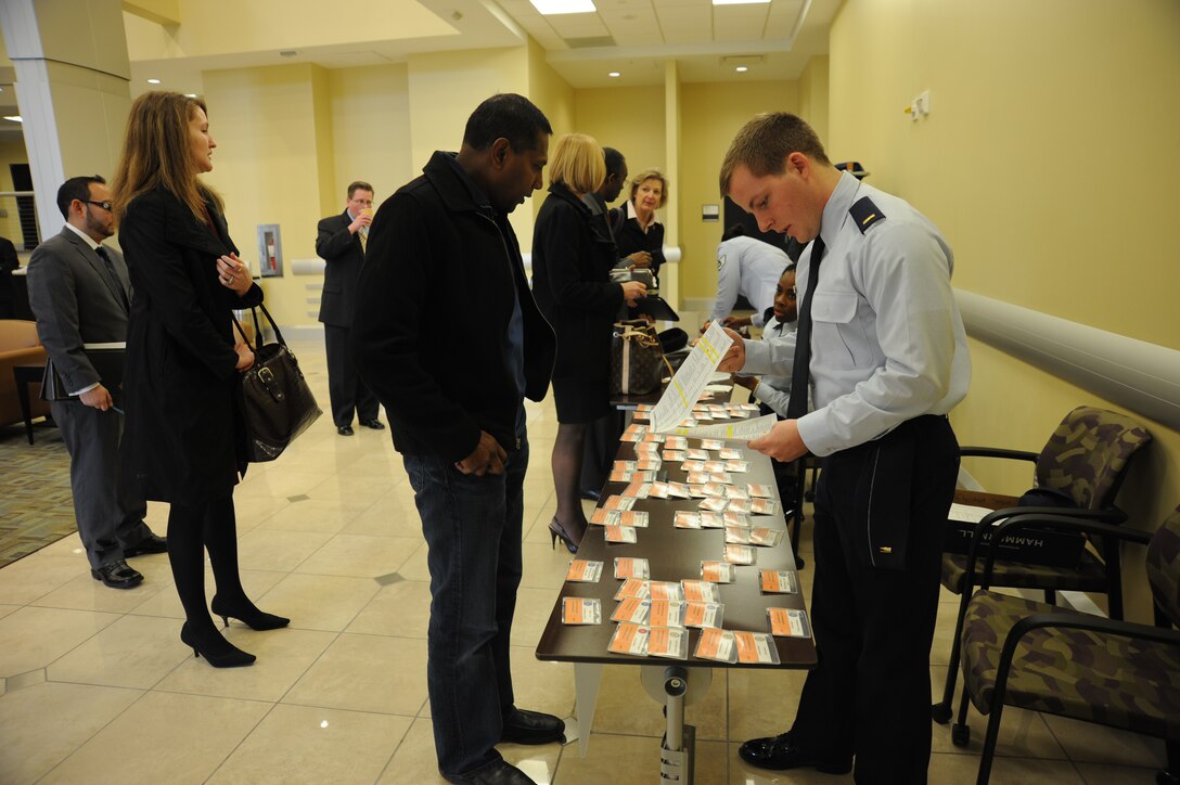 Members of the 11th Wing Contracting Squadron credential communtiy leaders and local small business owners for Business Summit 2013, held at the Jacob E. Smart building, Joint Base Andrews, Md, on Feb. 5. The summit provides the community with an opportunity for contractor/vendor outreach and networking with contracting officials from both the Air Force District of Washington and the 11 WG CS. (U.S. Air Force photo/ Staff Sgt. Amber Russell)