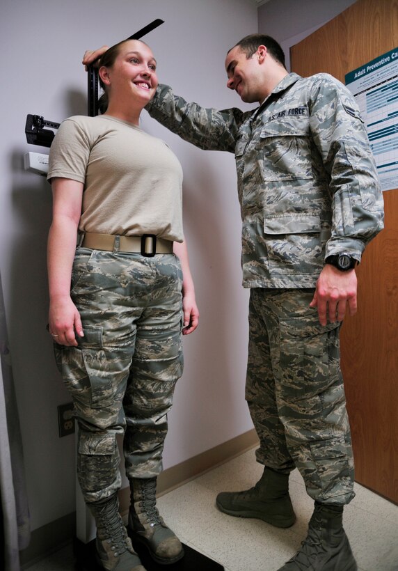 Airman 1st Class Andrew Noonan, 779th Medical Group family health technician, measures Airman 1st Class Audra Smith, 779 MDG family health technician, at Malcolm Grow Medical Clinic on Feb.7, 2013 on Joint Base Andrews, Md. The 779 MDG received recognition from the Patient-Centered Medical Home 2011 Program for their expertise in quality patient care. (U.S. Air Force photo/ Airman 1st Class Erin O’Shea)      