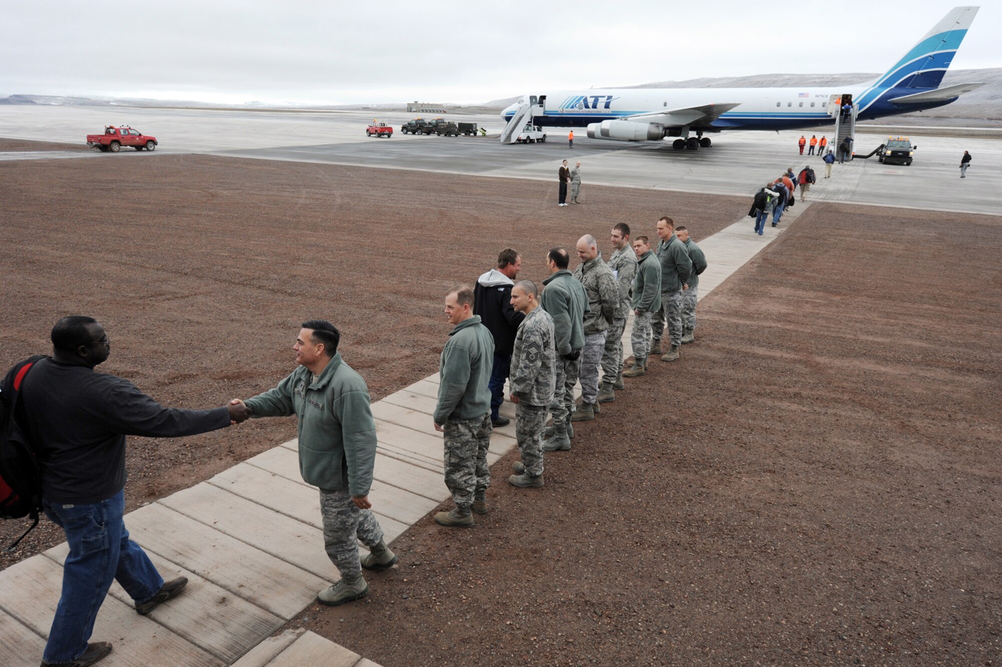 THULE AIR BASE, Greenland -- Thule personnel depart on the weekly rotator flight. Each person takes with them critical knowledge of the mission and experience that must be captured before departure. (U.S. Air Force photo)