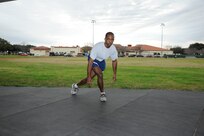 Skater plyo: 
Stand on your right foot with your right knee slightly bent, and place your left foot just behind your right ankle.  Bend your right knee and lower your body into a partial squat, then bound to the left by jumping off your right foot.  Land on your left foot and bring your right foot behind your left as you reach toward the floor with your right hand.  Repeat the move back toward the right, landing on your right foot and left hand. (U.S. Air Force photo by Don Lindsey)