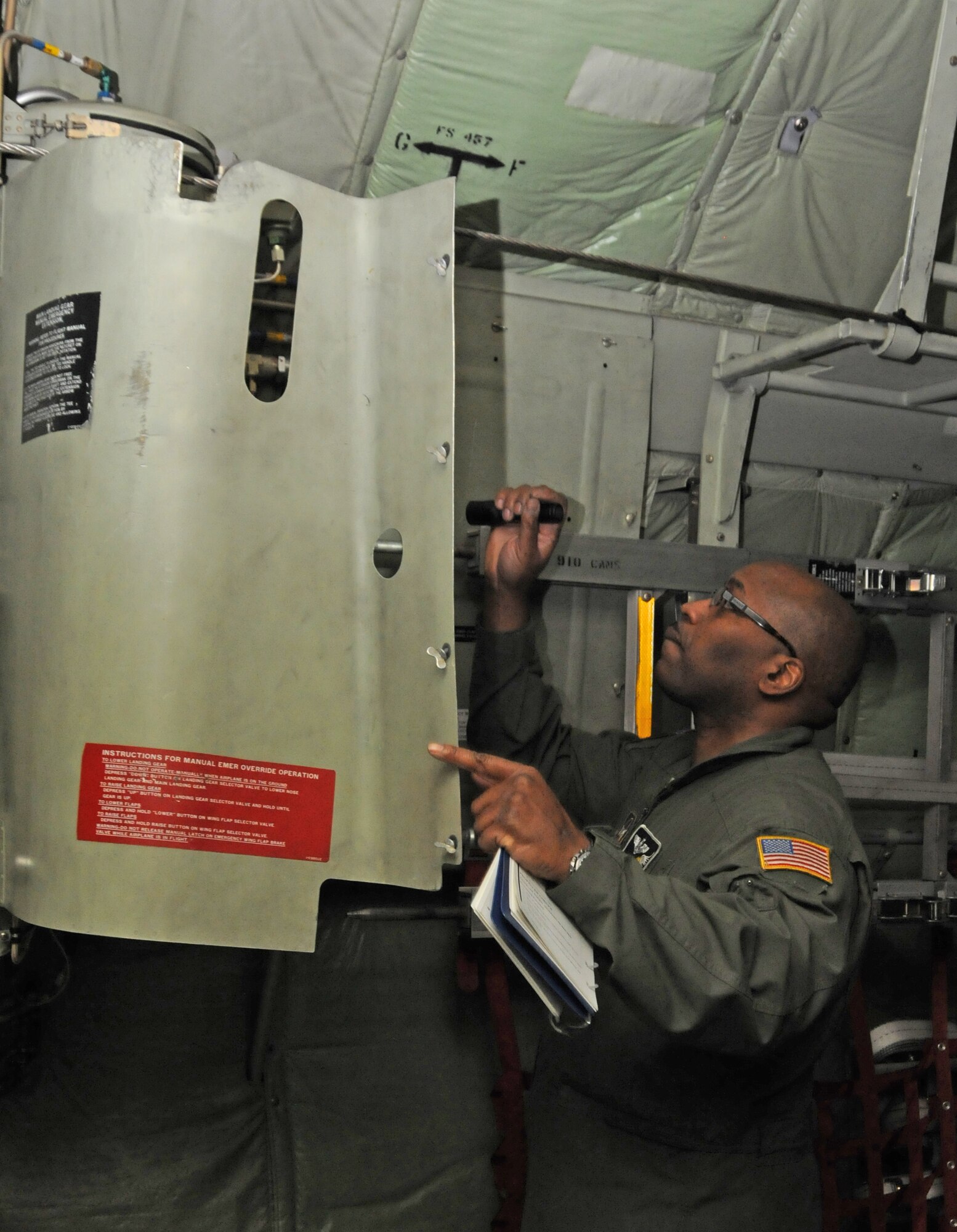 Senior Master Sgt. Charles Walker performs a dash one preflight inspection on a C-130H Hercules aircraft here, Feb. 3, 2013. SMSgt Walker is a Flight Engineer for the 773rd Airlift Squadron, Youngstown Air Reserve Station, Ohio. U.S. Air Force photo by Technical Sgt. James Brock