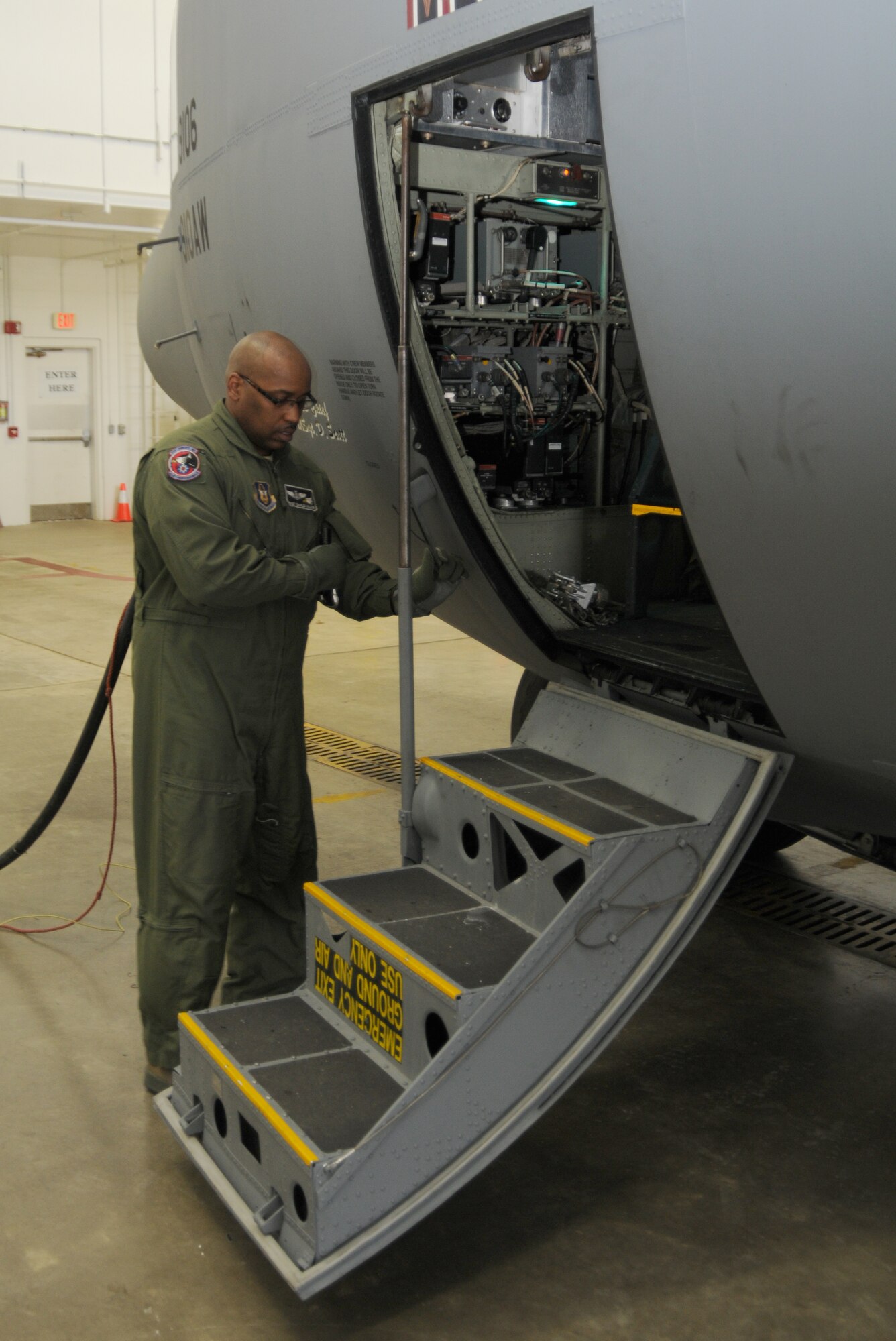 Senior Master Sgt. Charles Walker performs a dash one preflight inspection on a C-130H Hercules aircraft here, Feb. 3, 2013. SMSgt Walker is a Flight Engineer for the 773rd Airlift Squadron, Youngstown Air Reserve Station, Ohio. U.S. Air Force photo by Technical Sgt. James Brock