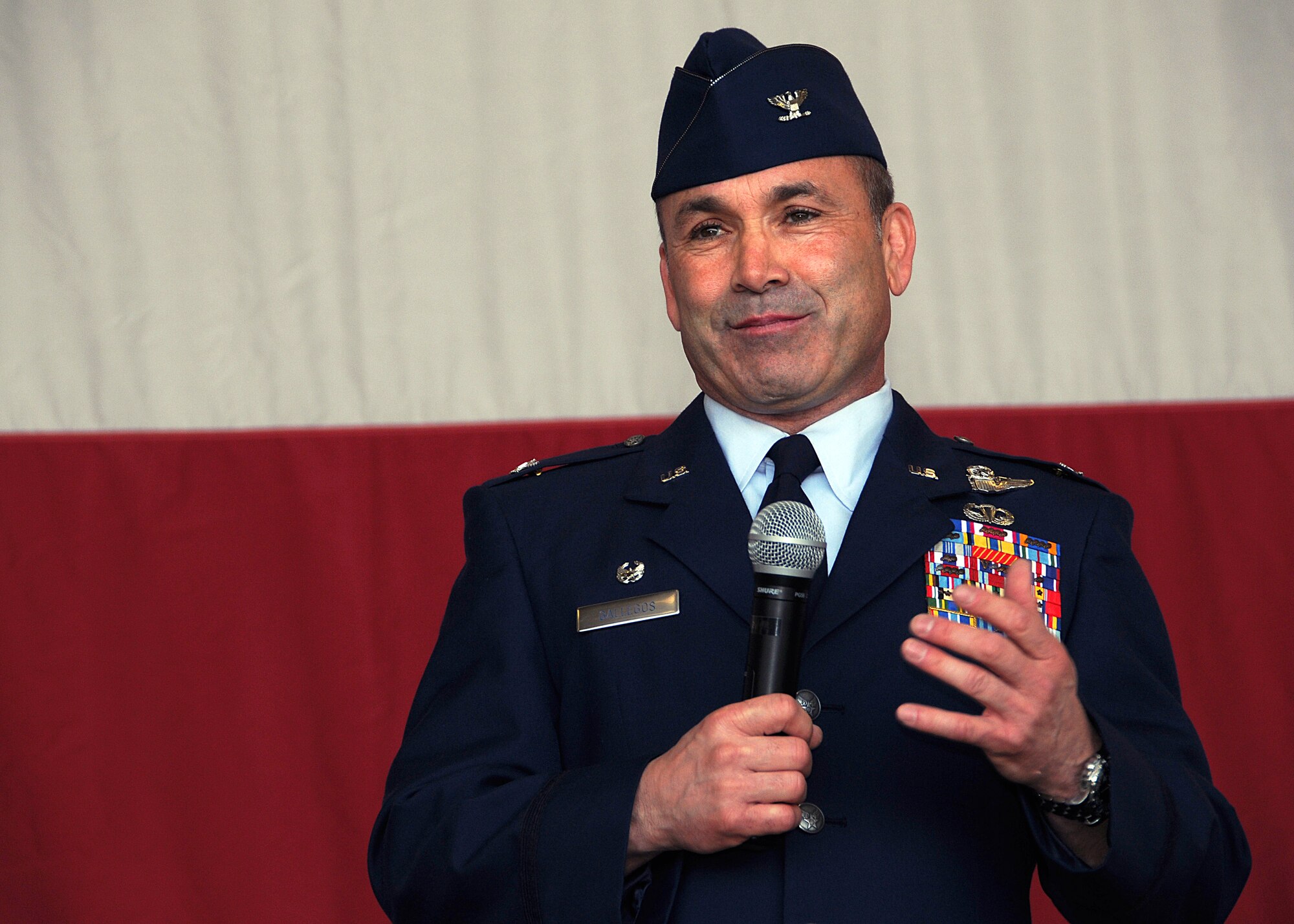 Col. Kurt J. Gallegos addresses the men and women of the 944th Fighter Wing after taking command of the Air Force Reserve unit at Luke Air Force Base, Ariz., Saturday. (U.S. Air Force Photo by Tech. Sgt. Louis Vega) 