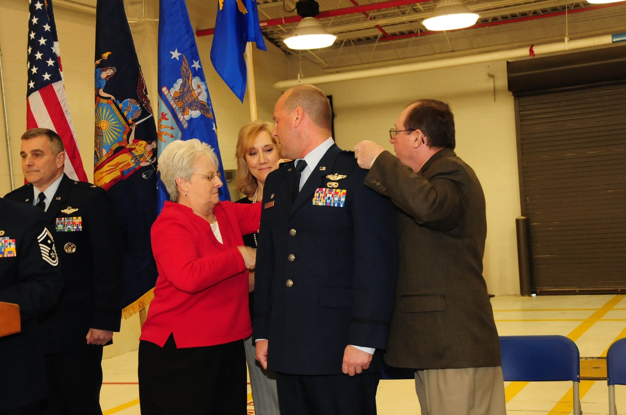 Many of Col. Bank's friends and family attended the assumption of command ceremony. His parents and wife pinned on his new colonel insignia as he was promoted. Feb, 10, 2013 (Air National Guard Photo/Senior Master Sgt. Ray Lloyd)