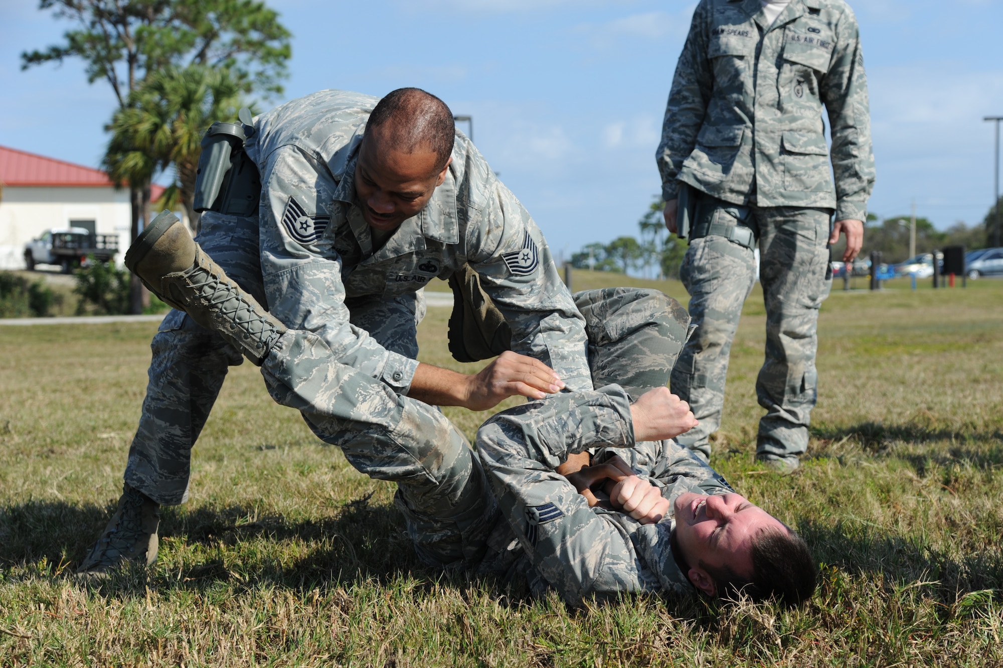 Tech. Sgt. Michael Sims, 927th Security Forces Squadron, successfully flips his opponent Senior Airman David Wittenauer, 927th SFS, during a security forces combatives training session at MacDill Air Force Base, February 10, 2013.  The 927th Security Forces Squadron, a reserve unit based at MacDill AFB, is implementing a new combative training program designed to help security forces Airmen better protect themselves and others in case of a hand-to-hand struggle against an aggressor.  
