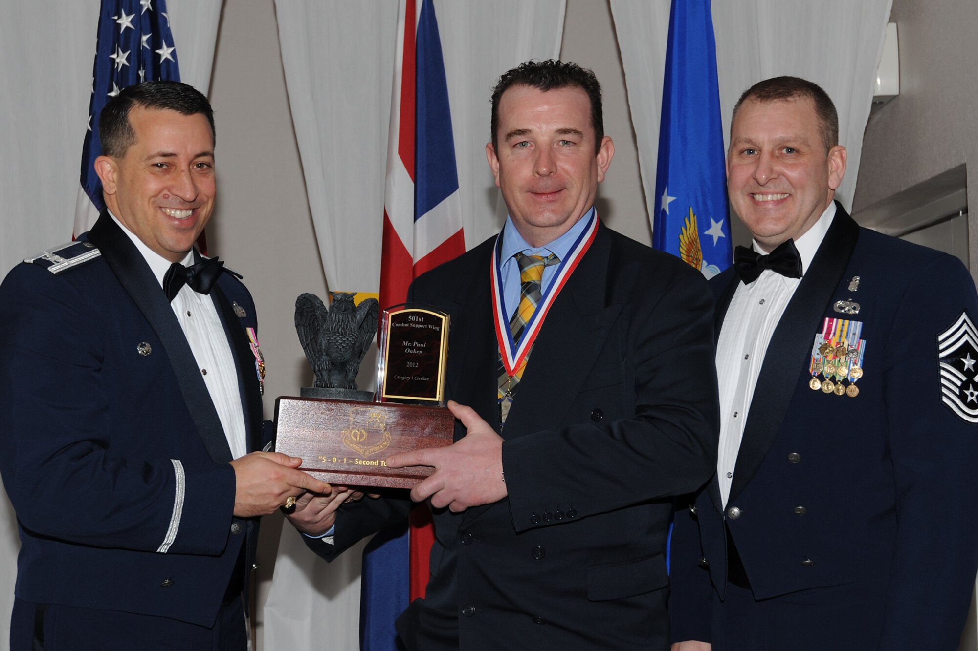 RAF CROUGHTON, United Kingdom - Paul Oakes, 423rd Civil Engineer Squadron, was named the 501st Combat Support Wing’s Civilian Category I of the Year during the 501st CSW Annual Awards at RAF Croughton Feb. 8. In 2012, Oakes, from Ayr, Scotland, drove a shift of 27 firefighters' DoD certification rate from 85 percent to 96 percent in six months, which is the best in USAFE. He also built a new firefighter maintenance program for an aging $10 million fire truck fleet, which earned him a "Top Wheels" award and "Outstanding" rating by 501st CSW Logistics. (U.S. Air Force photo by Tech. Sgt. Chrissy Best)