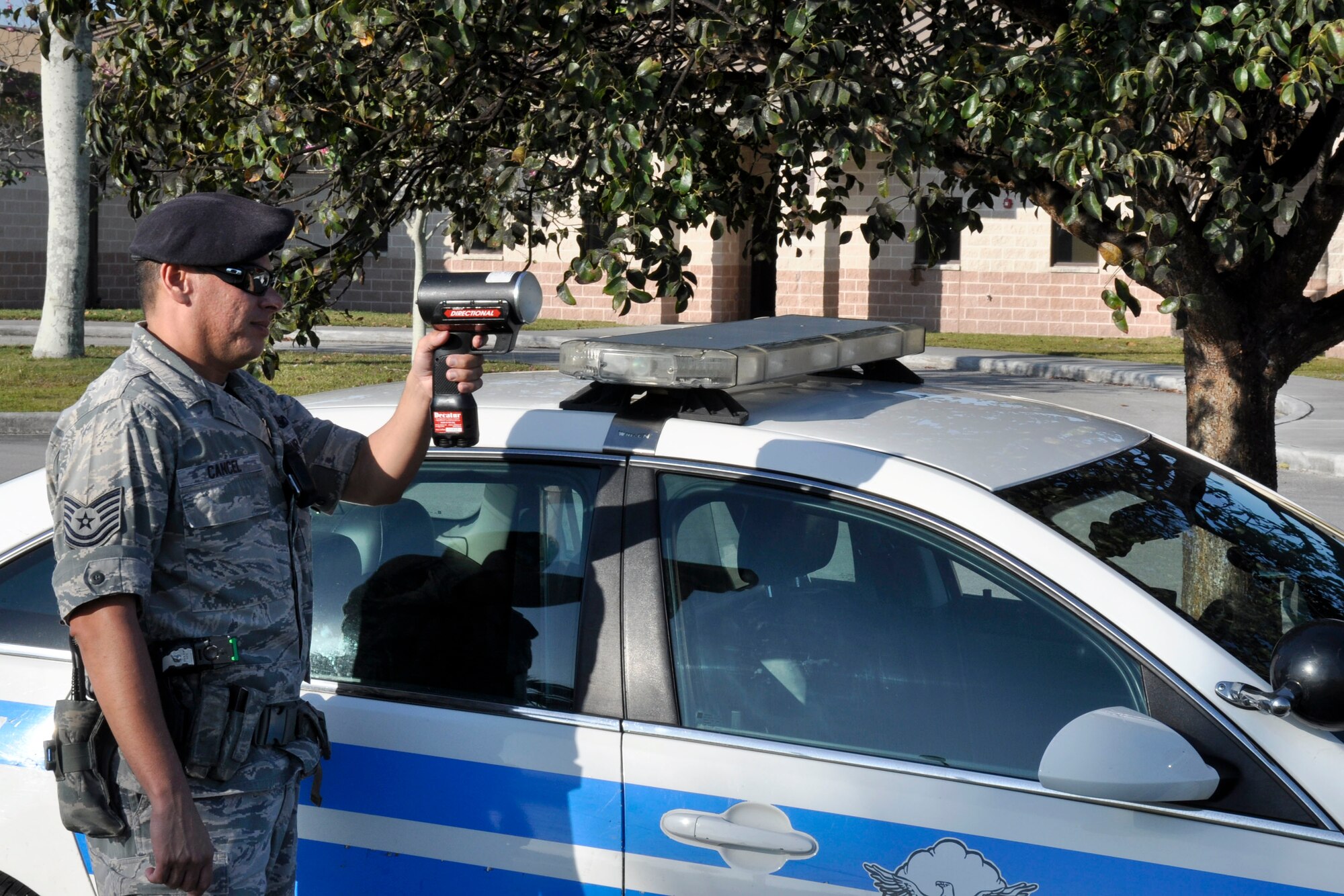 Tech. Sgt. Rickie Cancel, 482nd Security Forces Squadron, sets up with his radar gun to monitor speeding at Homestead Air Reserve Base, Fla., Feb. 5. (U.S. Air Force photo/Senior Airman Nick Caceres)