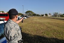 Tech. Sgt. Rickie Cancel, 482nd Security Forces Squadron, sets up with his radar gun to monitor speeding at Homestead Air Reserve Base, Fla., Feb. 5. 
