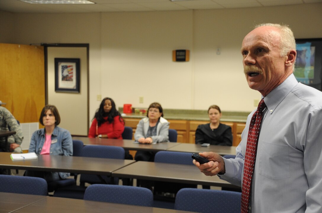 David Anderson (fore), Region Nine education specialist based in Wichita Falls, Texas, talks with parents about bullying at the Sheppard Airmen & Family Readiness Center on Feb. 8, 2013.  Anderson's presentation was designed to help parents understand bullying and what they can do to help their children. (U.S. Air Force photo/Airman 1st Class Jelani Gibson)