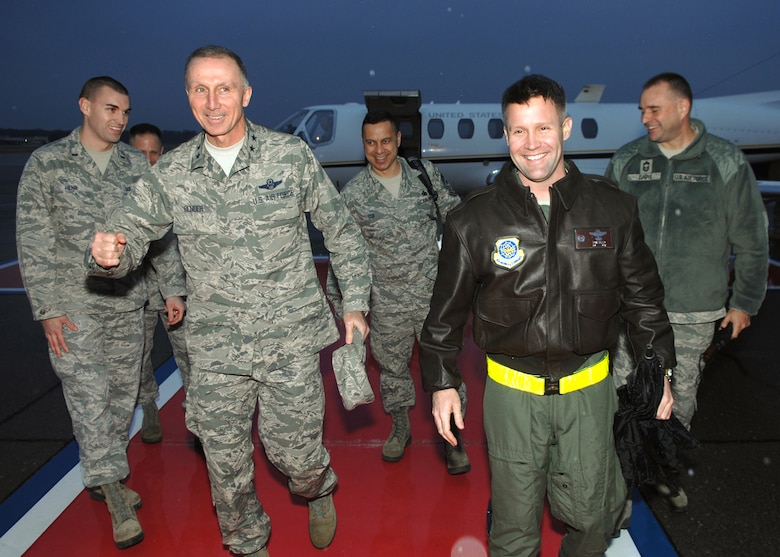Col Daniel Tulley, right, 43rd Airlift Group commander, welcomes  Maj. Gen. William Bender, U.S. Air Force Expeditionary Center commander, to Pope Army Airfield, N.C. during his tour of Air Mobility Command bases under his administrative control.  Maj. Gen. Bender along with his command chief, Chief Master Sgt. Jeffrey Cui, toured 43rd AG facilities, received mission briefings, conducted an "All Call" and served as the guest speaker for the group's annual awards banquet.