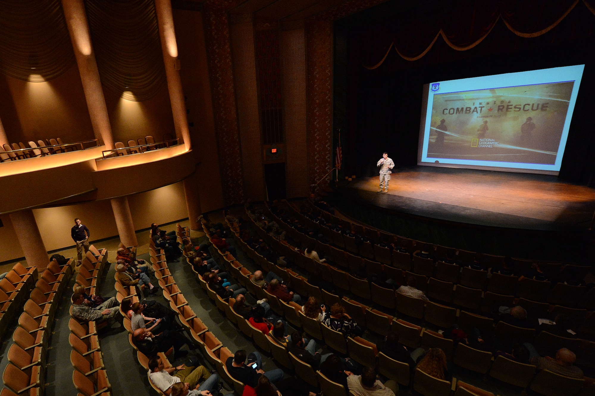 U.S. Air Force Maj. David Faggard, 9th Air Force Public Affairs officer welcomes guests before the presentation of the National Geographic Inside Combat Rescue premiere at Sumter Opera House, Sumter, S.C., Feb. 9, 2013.  Airmen from Shaw and locals from the community gathered for a sneak peak at the documentary which will be released Feb. 18.  For the first time, cameras from National Geographic were allowed to follow pararescue Airmen downrange and capture their experiences on the job that they face on a deployment. (U.S. Air Force photo by Airman 1st Class Nicole Sikorski/Released)