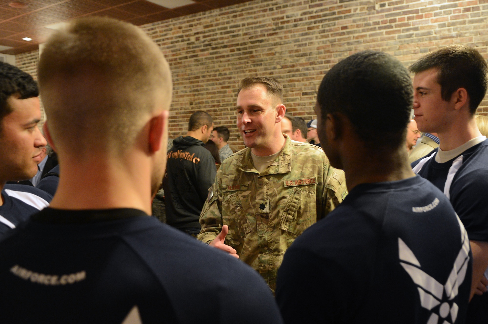 U.S. Air Force Lt. Col. Joe Alkire, pararescue pedro pilot speaks with delayed entry program applicants at the National Geographic Inside Combat Rescue premiere at Sumter Opera House, Sumter, S.C., Feb. 9, 2013.  Airmen from Shaw and locals from the community gathered for a sneak peak at the documentary which will be released Feb. 18.  For the first time, cameras from National Geographic were allowed to follow pararescue Airmen downrange and capture their experiences on the job that they face on a deployment. (U.S. Air Force photo by Airman 1st Class Nicole Sikorski/Released)