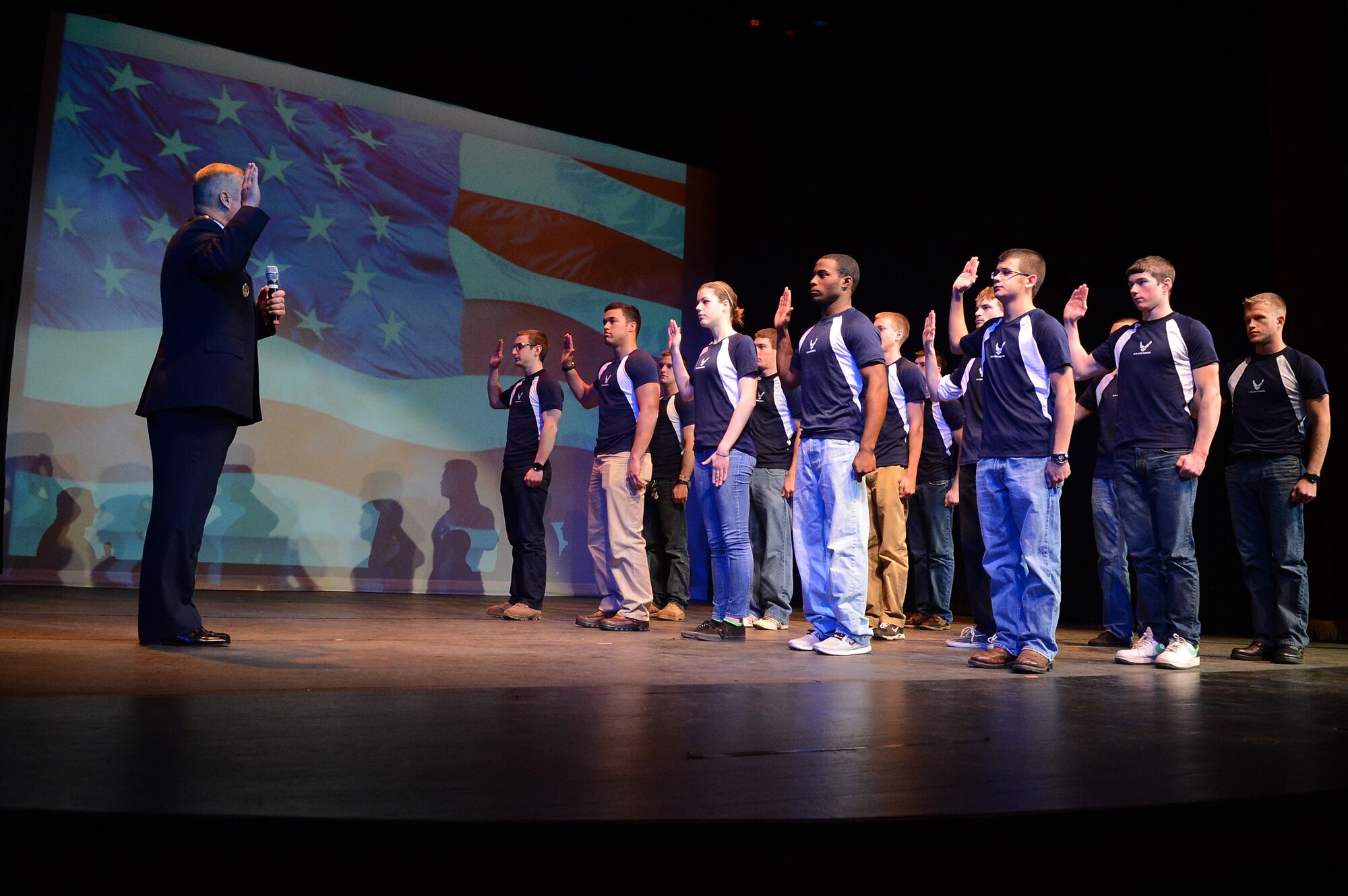 U.S. Air Force Maj. Gen. Lawrence Wells, 9th Air Force commander swears in delayed entry program applicants during the Oath of Enlistment, at the National Geographic Inside Combat Rescue premiere at Sumter Opera House, Sumter, S.C., Feb. 9, 2013.  Airmen from Shaw and locals from the community gathered for a sneak peak at the documentary which will be released Feb. 18.  For the first time, cameras from National Geographic were allowed to follow pararescue Airmen downrange and capture their experiences on the job that they face on a deployment. (U.S. Air Force photo by Airman 1st Class Nicole Sikorski/Released)