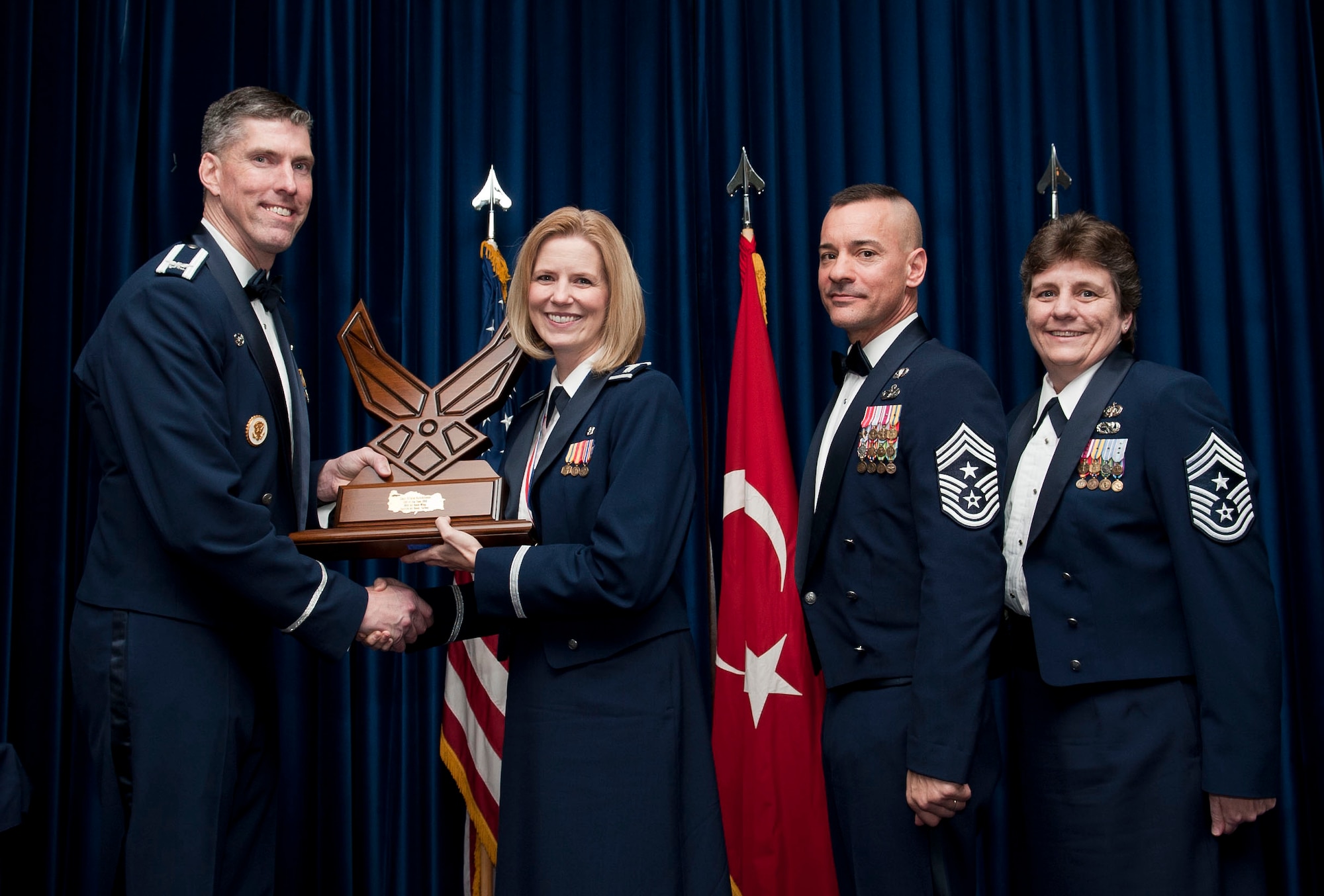 Capt. Krista Hutchinson, 39th Medical Operations Squadron, receives the 39th Air Base Wing Company Grade Officer of the Year award from Col. Chris Craige, 39th Air Base Wing commander, during the 2012 Annual Awards Banquet Feb. 8, 2013, at Incirlik Air Base, Turkey. (U.S. Air Force photo by Senior Airman Daniel Phelps/Released)