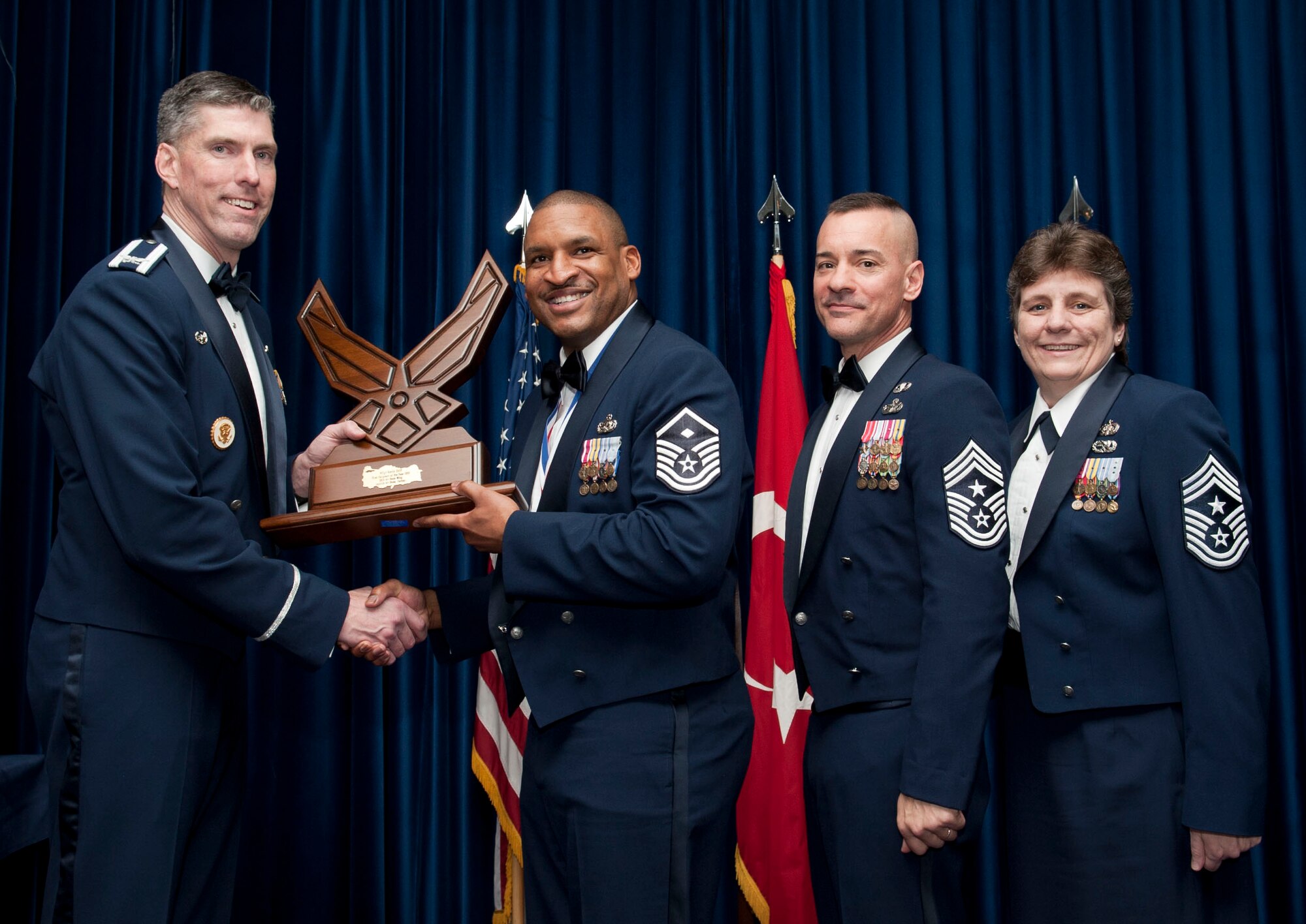 Master Sgt. Kevin Stiff, 39th Security Forces Squadron, receives the 39th Air Base Wing First Sergeant of the Year award from Col. Chris Craige, 39th Air Base Wing commander, during the 2012 Annual Awards Banquet Feb. 8, 2013, at Incirlik Air Base, Turkey. (U.S. Air Force photo by Senior Airman Daniel Phelps/Released)