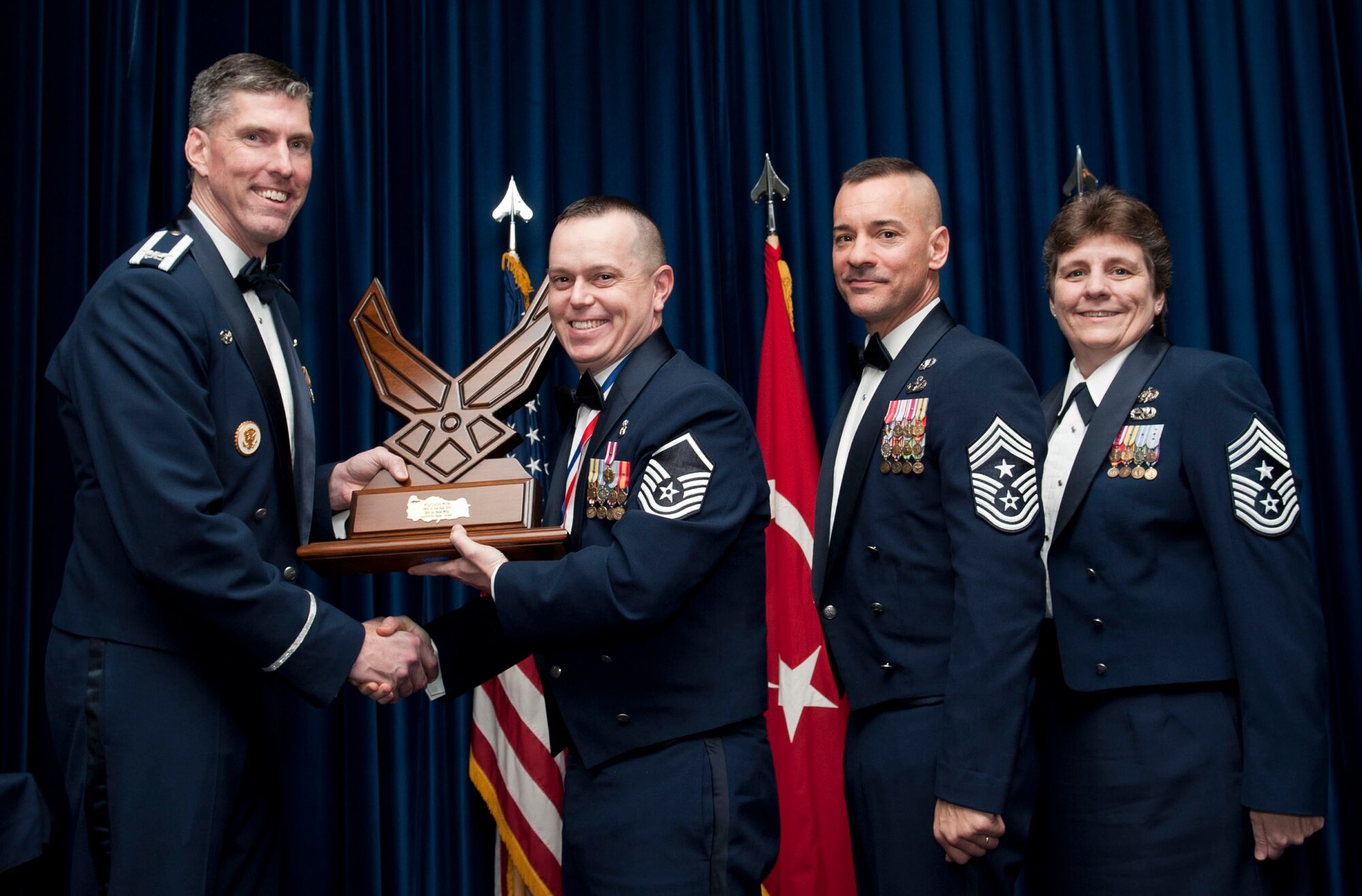 Master Sgt. Curtis Miller, 39th Medical Support Squadron, receives the 39th Air Base Wing Senior Noncommissioned Officer of the Year award from Col. Chris Craige, 39th Air Base Wing commander, during the 2012 Annual Awards Banquet Feb. 8, 2013, at Incirlik Air Base, Turkey. (U.S. Air Force photo by Senior Airman Daniel Phelps/Released)
