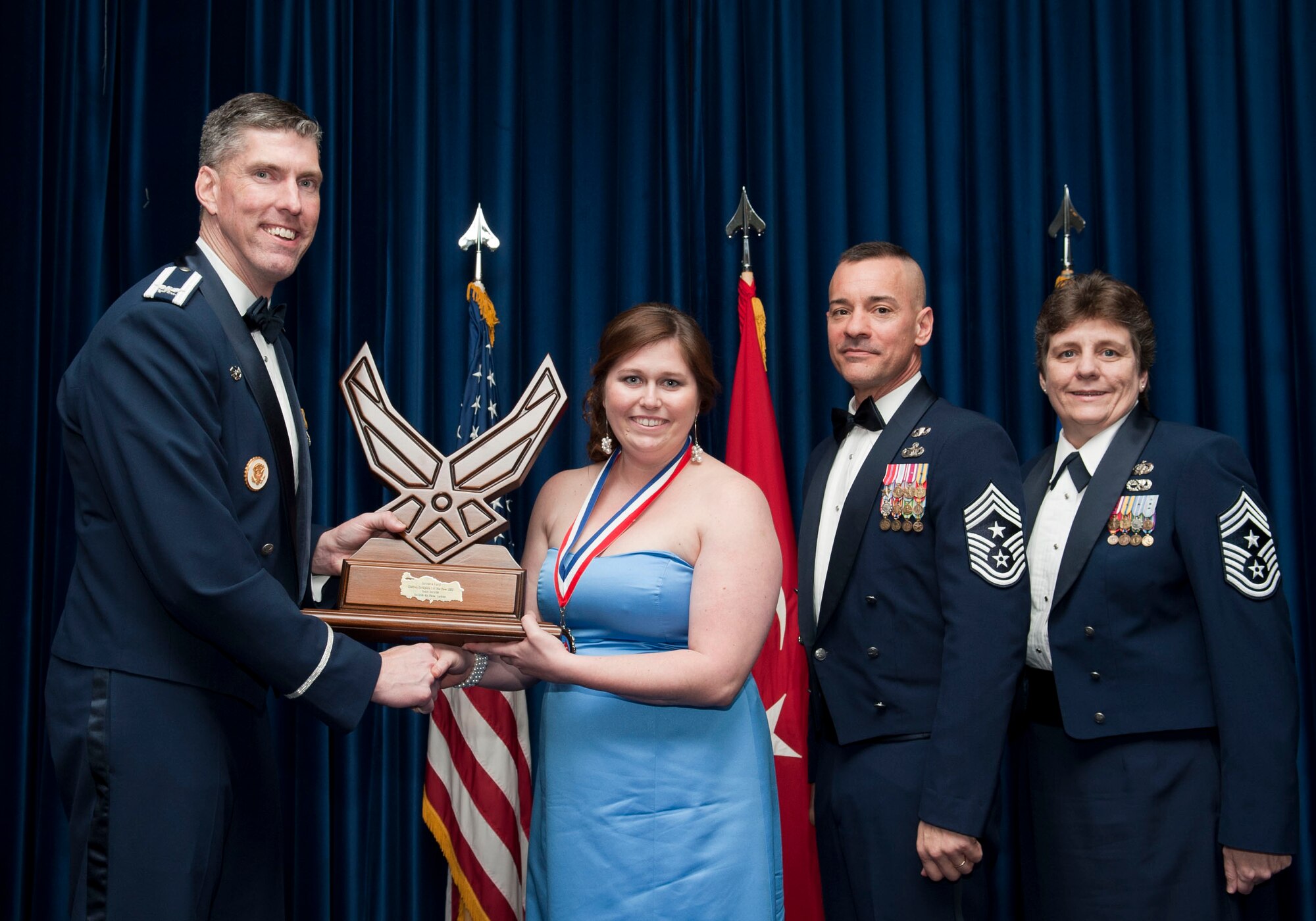 Jessica Ford, 728th Air Mobility Squadron, receives the Team Incirlik Civilian of the Year Category I award from Col. Chris Craige, 39th Air Base Wing commander, during the 2012 Annual Awards Banquet Feb. 8, 2013, at Incirlik Air Base, Turkey. (U.S. Air Force photo by Senior Airman Daniel Phelps/Released)