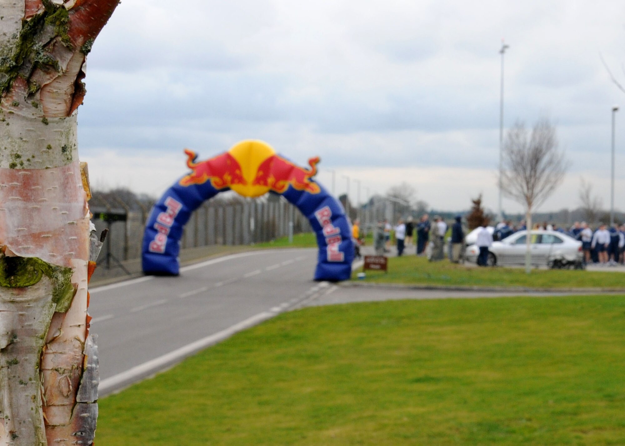 Team Mildenhall members arrive to take part in the monthly wing run Feb. 8, 2013, on Perimeter Road near the Hardstand Fitness Center on RAF Mildenhall, England. The run takes place on the first Friday of every month and is mandatory for all 100th Air Refueling Wing military personnel but tenant units and base ID card holders 13-years and older are welcome to attend. (U.S. Air Force photo by Gina Randall/Released)