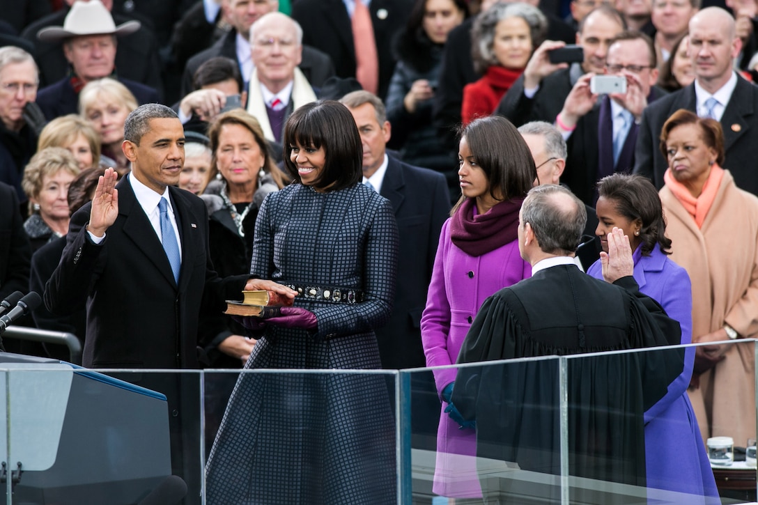 Supreme Court Chief Justice John Roberts (right) administers the oath of office to President Barack Obama during the inaugural swearing-in ceremony at the U.S. Capitol in Washington, D.C., Jan. 21, 2013. First Lady Michelle Obama holds a Bible that belonged to Dr. Martin Luther King Jr., and the Lincoln Bible, which was used at President Obama’s 2009 inaugural ceremony. Daughters Malia and Sasha stand with their parents. 

