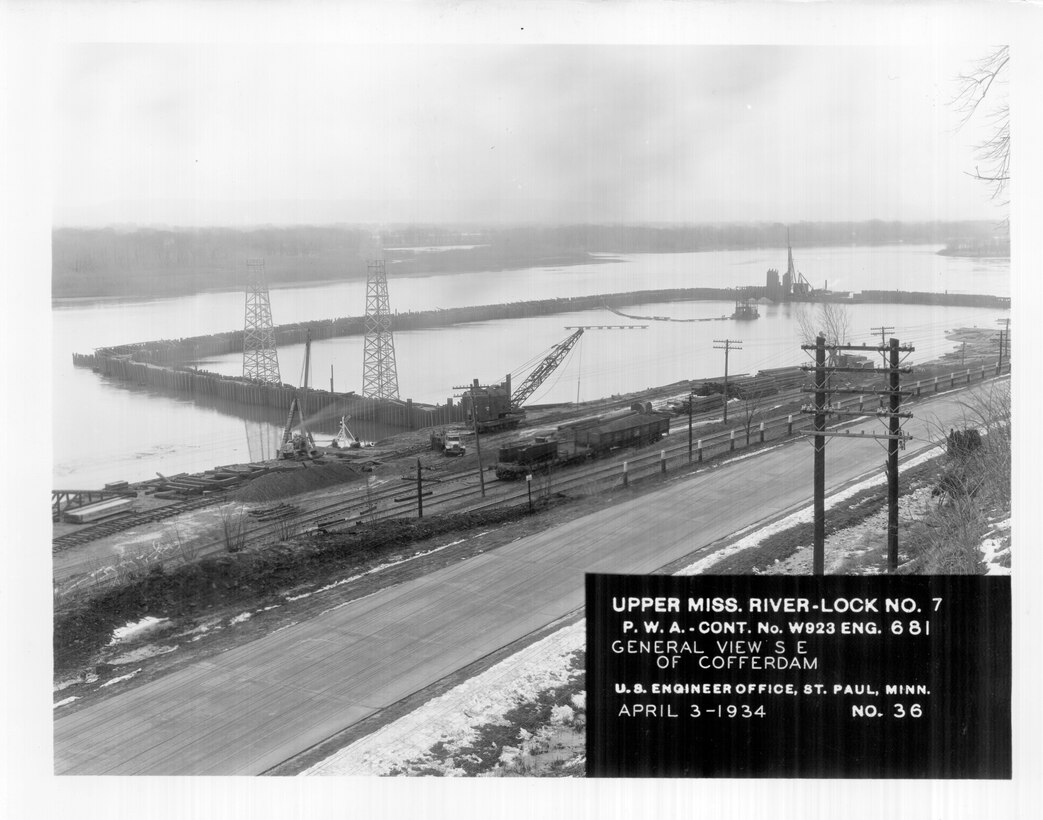 Construction of Lock and Dam 7 on the Upper Mississippi River in La Crescent, Minn., April 3, 1934. General view southeast of coffer dam.
