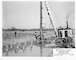 Construction of Lock and Dam 7 on the Upper Mississippi River in La Crescent, Minn., Oct. 23, 1935. Driving wood piling in spillway section.