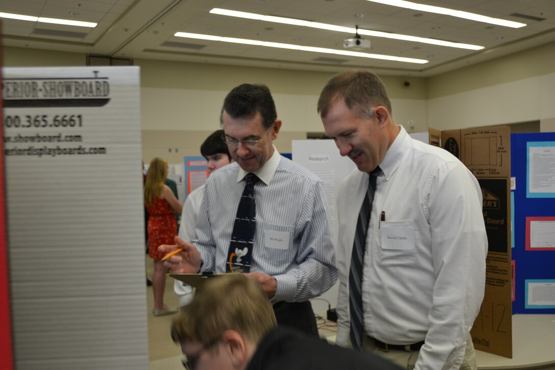 Electrical engineers Wil Wright, Middle East District, and David Clarke, Transatlantic Division, discuss an intriguing aspect of one of the projects. 