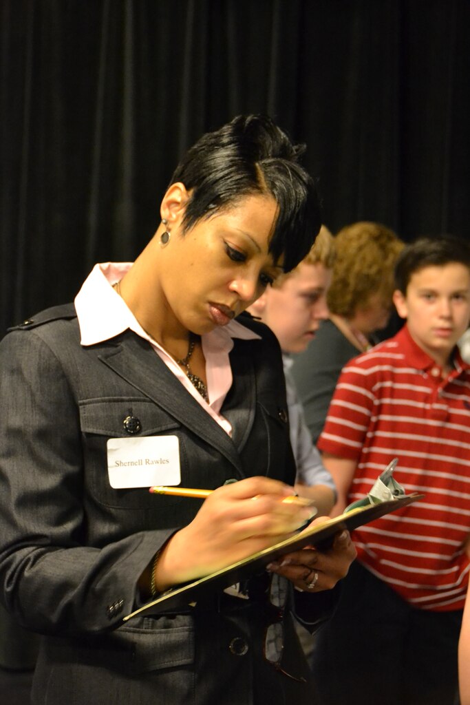 Shernell Rawles scores a science project after the oral presentation.
