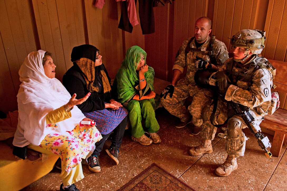 Role players acting as Afghan villagers express their concerns to Army Sgt. Victoria Shapiro, right, at a mock Afghan village during exercise Warrior Spear on Schofield Barrack on Wahiawa, Hawaii, Feb. 5, 2013. Shapiro is assigned to the 25th Infantry Division’s Company C, 1st Battalion, 14th Infantry Regiment, 2nd Stryker Brigade Combat Team.