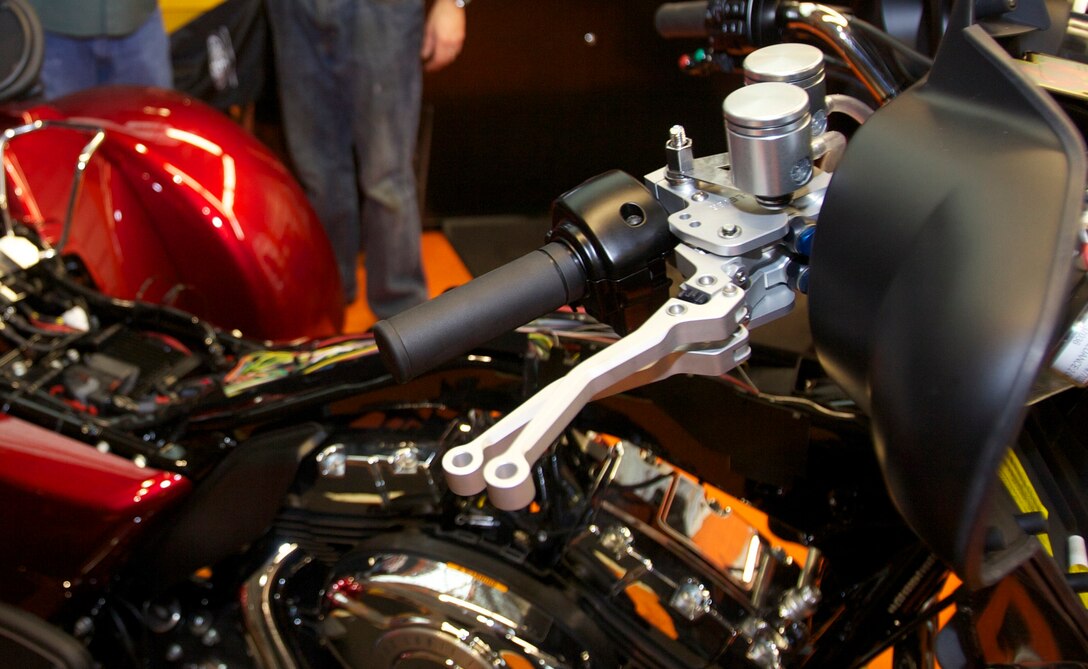 On the third anniversary of his survival, recently retired Sgt. Maj. Raymond H. Mackey, a double amputee with Wounded Warrior Battalion East, received his brand new Harley Davidson Tri-Glide, complete with the Kliktronic electronic gear actuator and factory reverse, as well as custom paint job and detailing on Dec. 23, 2012, in Jacksonville N.C. The trike is tailor-made for him, allowing him to ride without the use of his legs by utilizing specialized breaks and shifters.